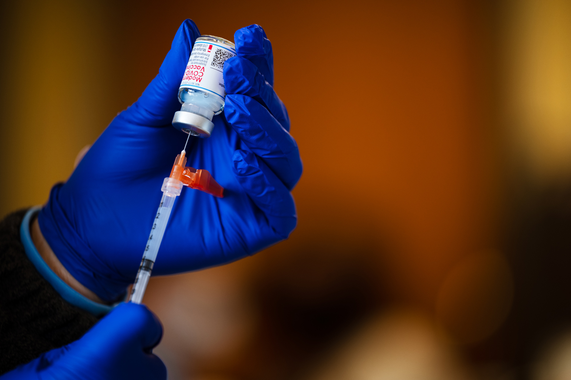 A medical technician fills a syringe from a vial of the Moderna COVID-19 vaccine in Bates Memorial Baptist Church on February 12 in Louisville, Kentucky. 