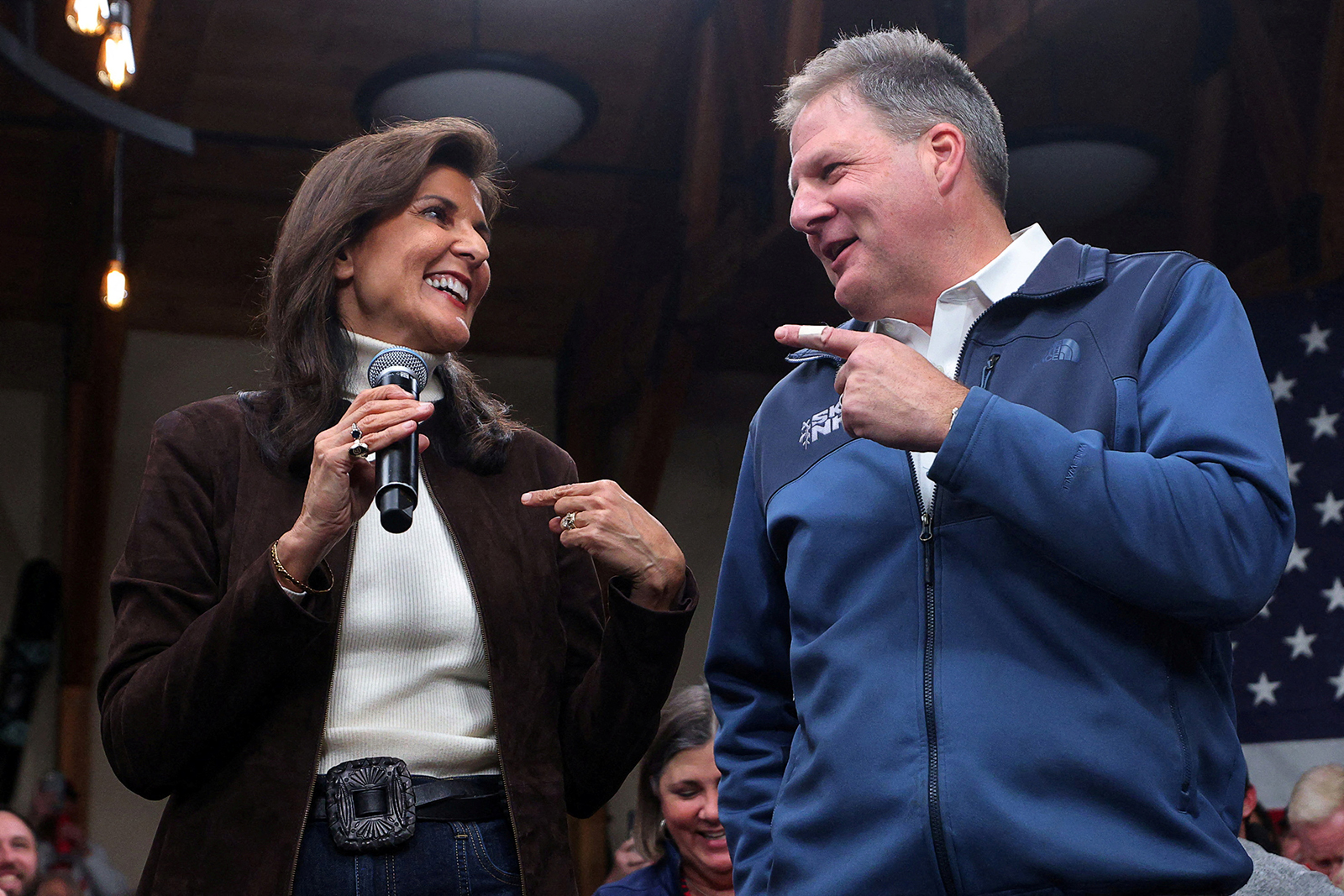 Republican presidential candidate and former U.S. Ambassador to the United Nations Nikki Haley is endorsed by New Hampshire Governor Chris Sununu at a campaign town hall in Manchester, New Hampshire, on December 12, 2023. 