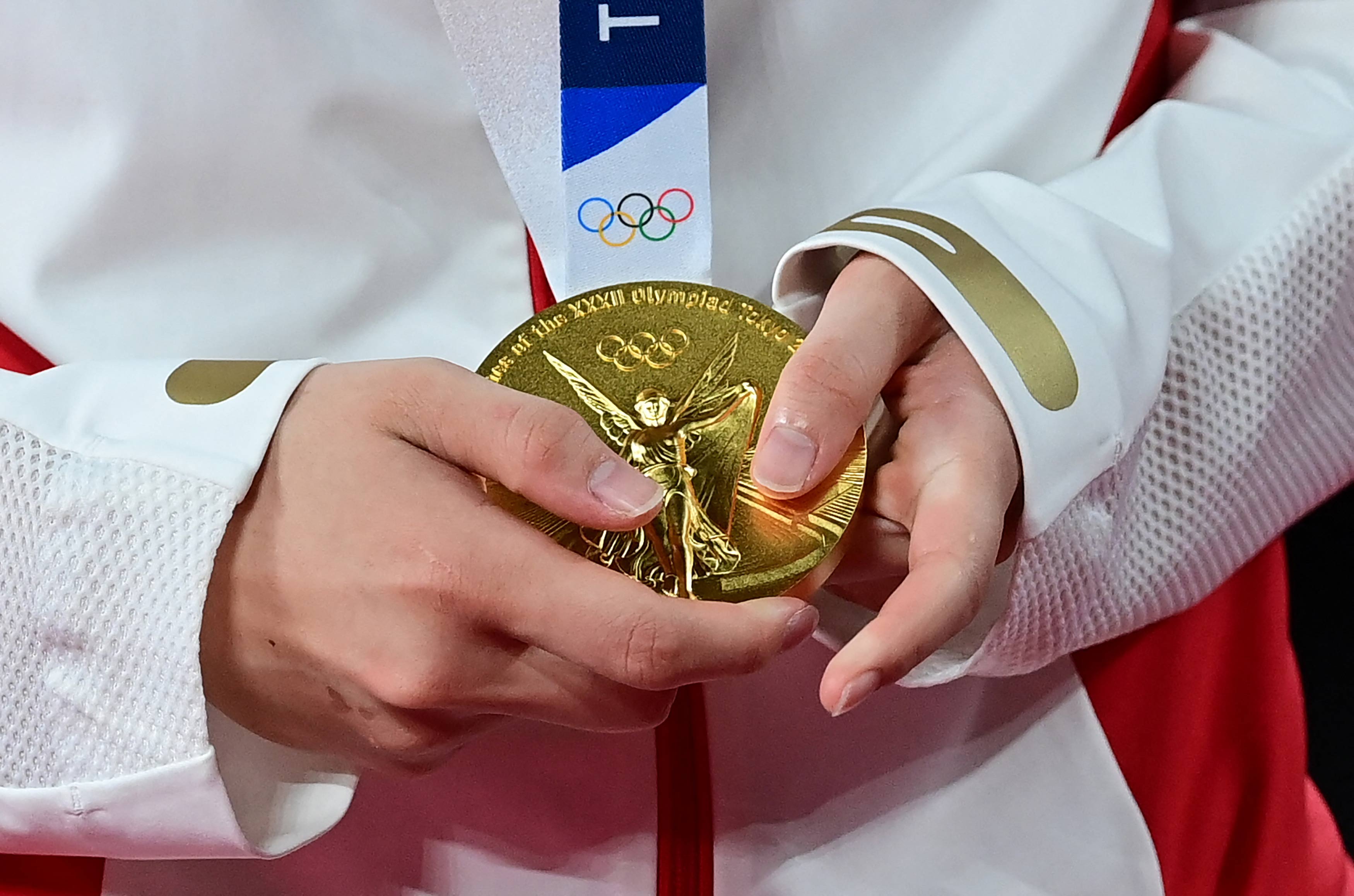 China's Chen Yufei holds her singles badminton gold medal on August 1.