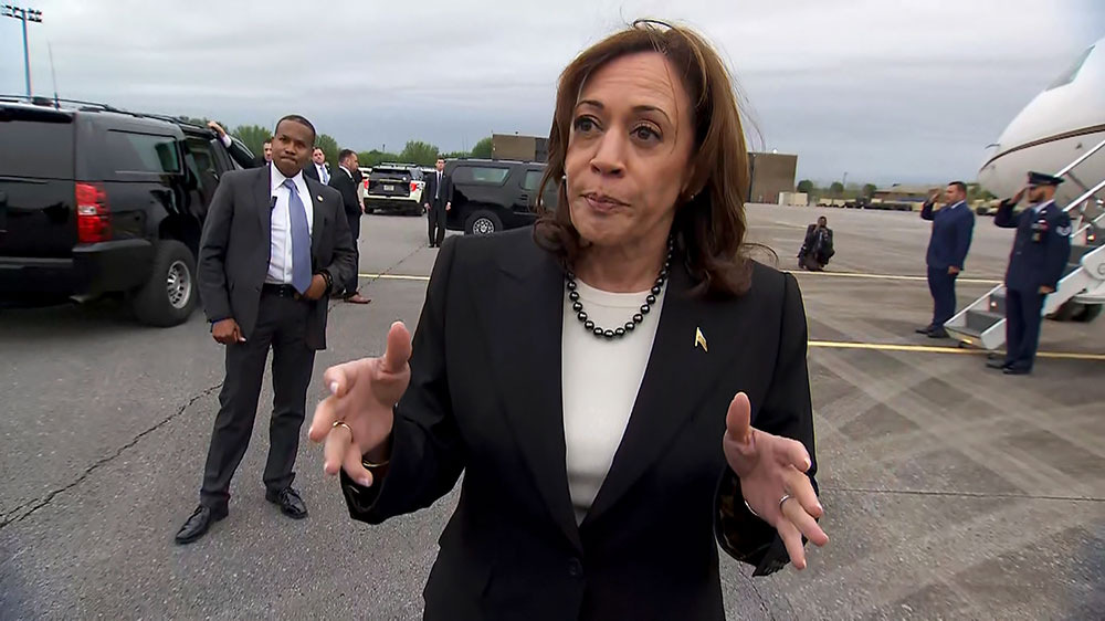 Harris speaks with reporters at an airfield in Nashville on Friday, April 7.