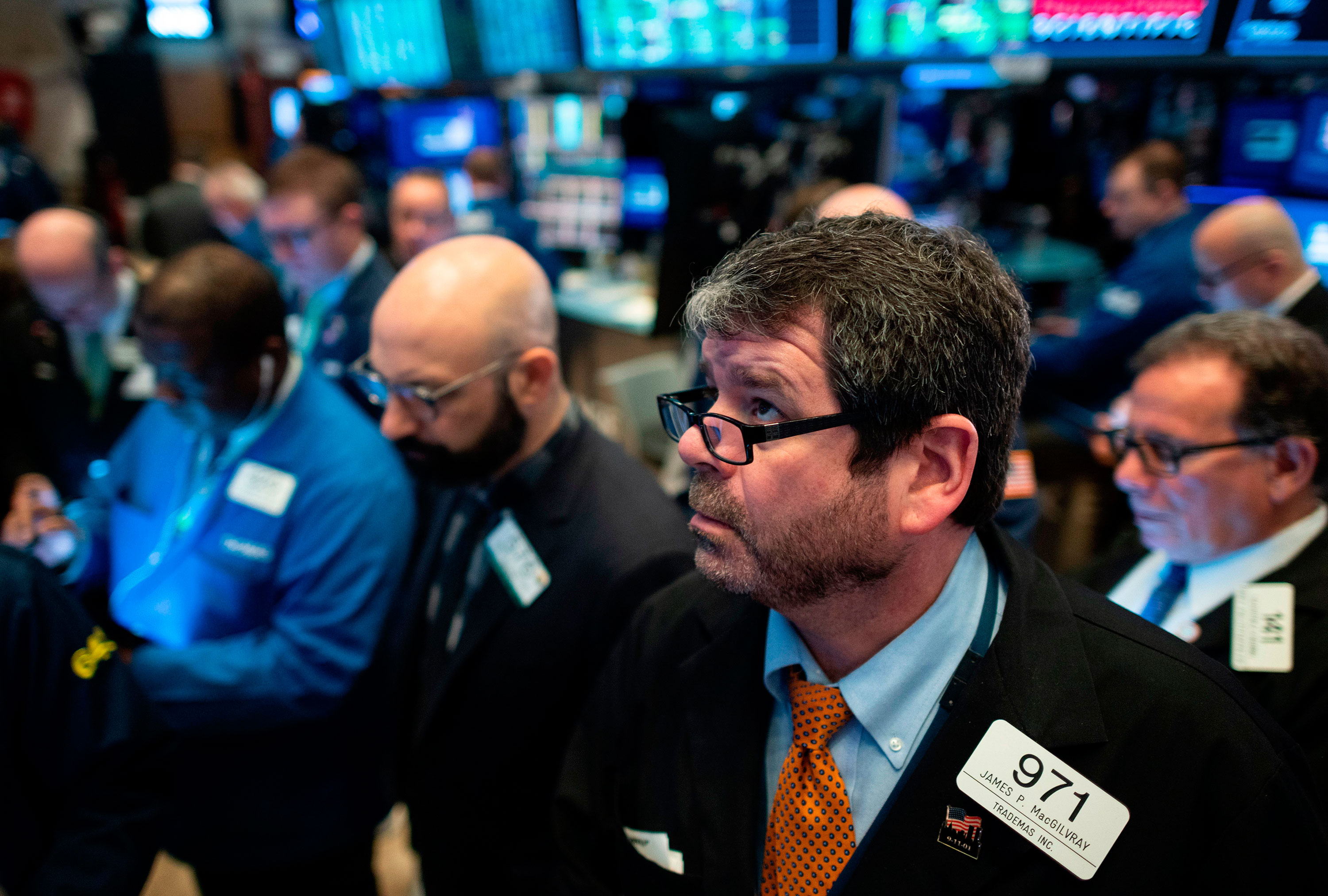 Traders work during the opening bell at the New York Stock Exchange on March 13.