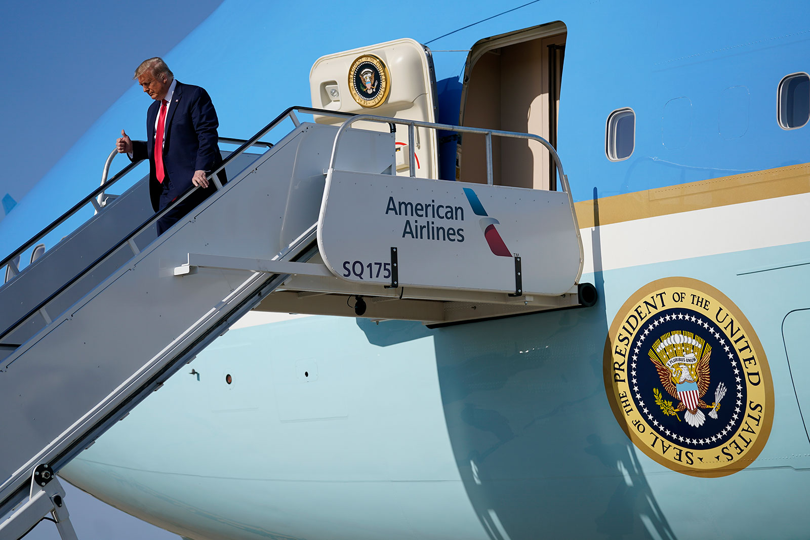 President Donald Trump exits Air Force One as he arrives at Tulsa International Airport on Saturday.