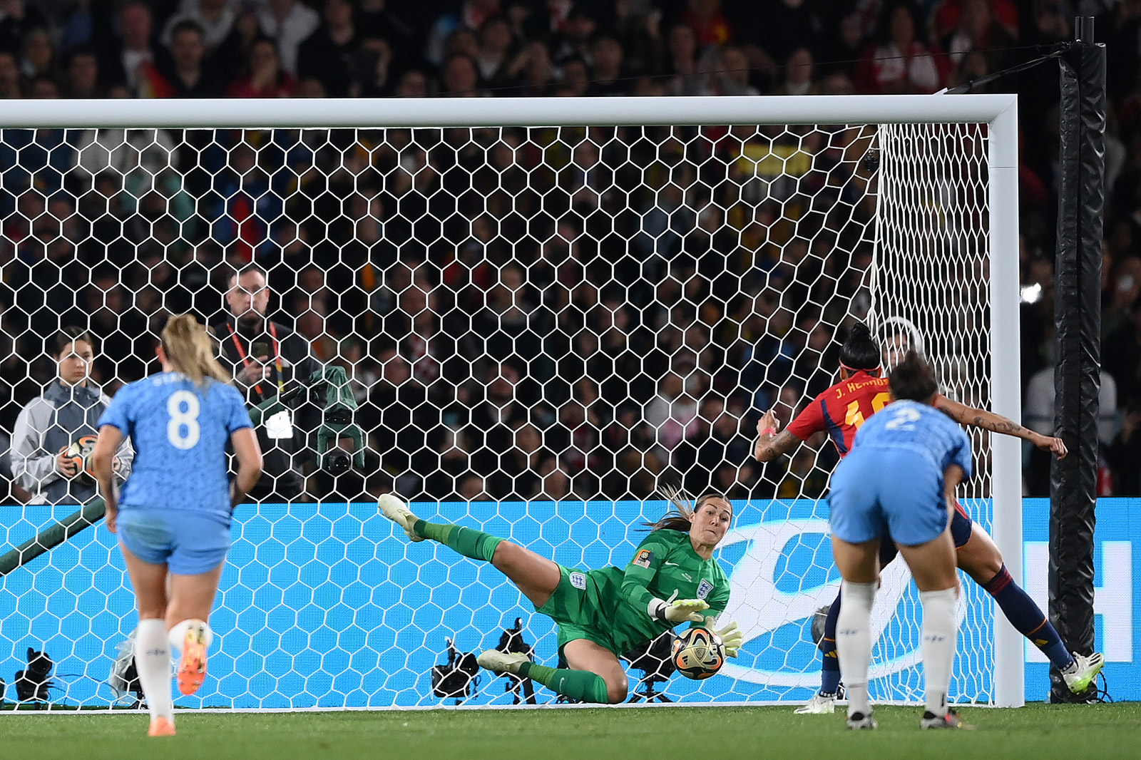 England goalkeeper Mary Earps makes a save on a kick taken by Jennifer Hermoso.
