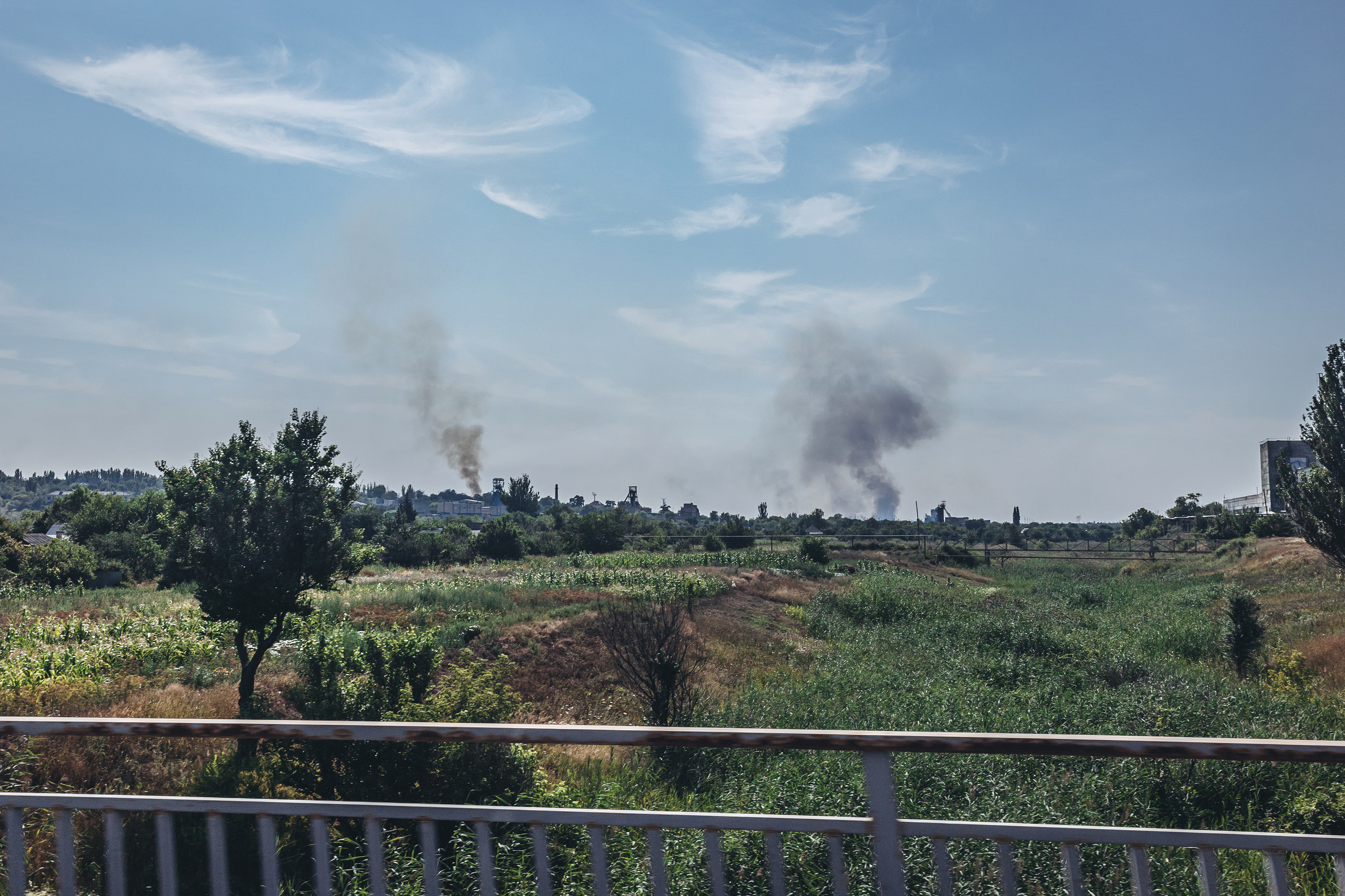 Two plumes of smoke from Soledar in the Donetsk region on July 25.