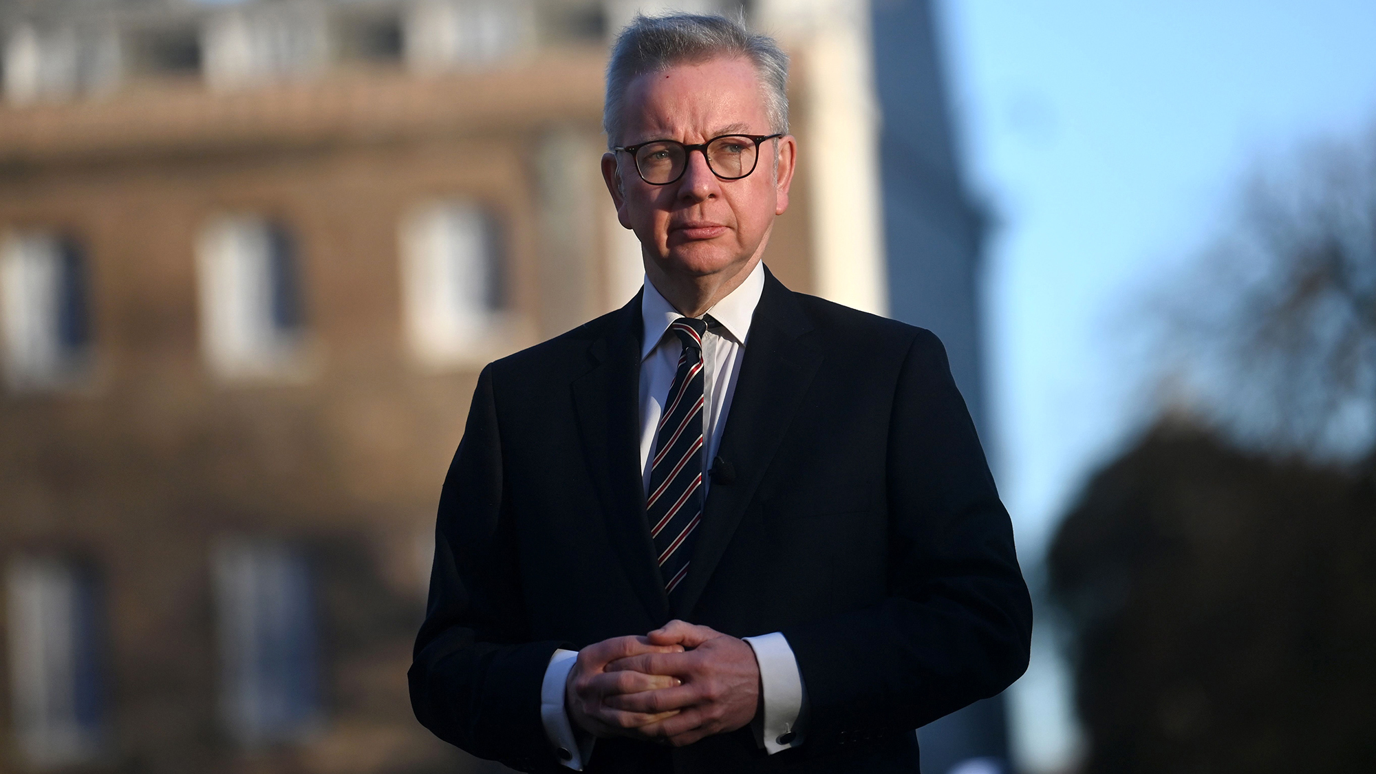 UK Cabinet minister Michael Gove speaks with reporters in London on February 2. 