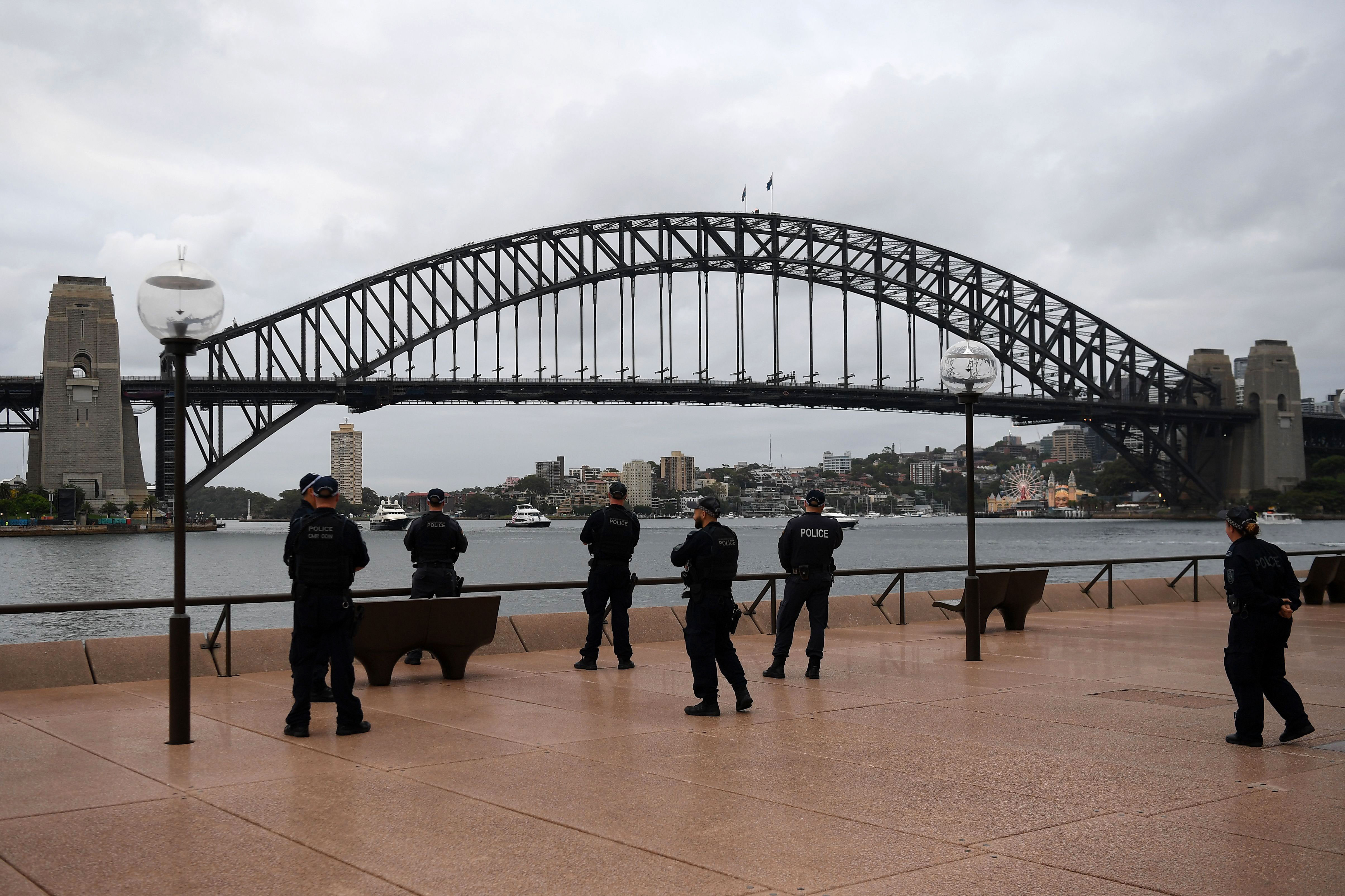 New South Wales police officers patrol near Sydney Opera House in Australia on December 31.