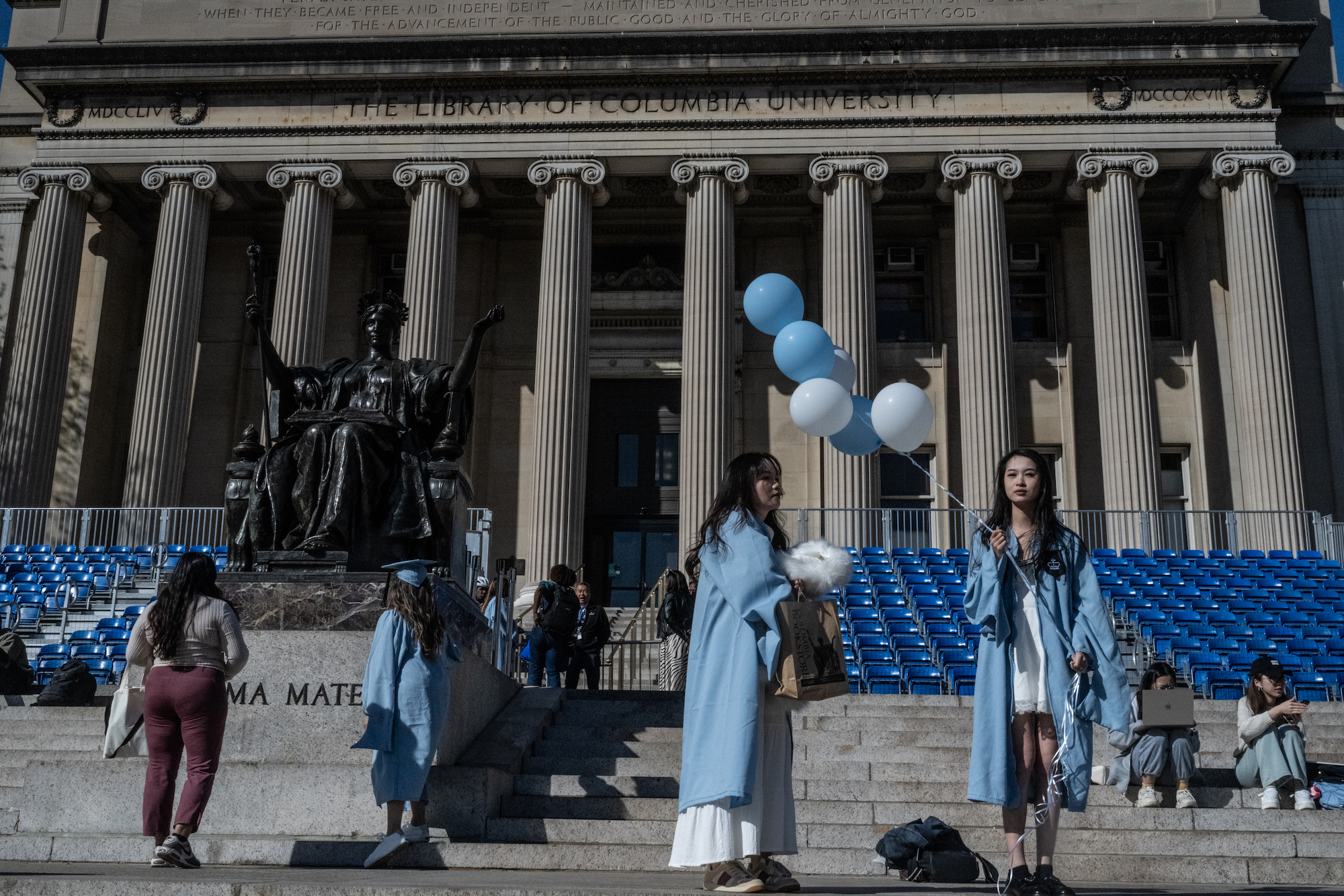 Students pose in their graduation gowns at Columbia University in New York City on April 25.