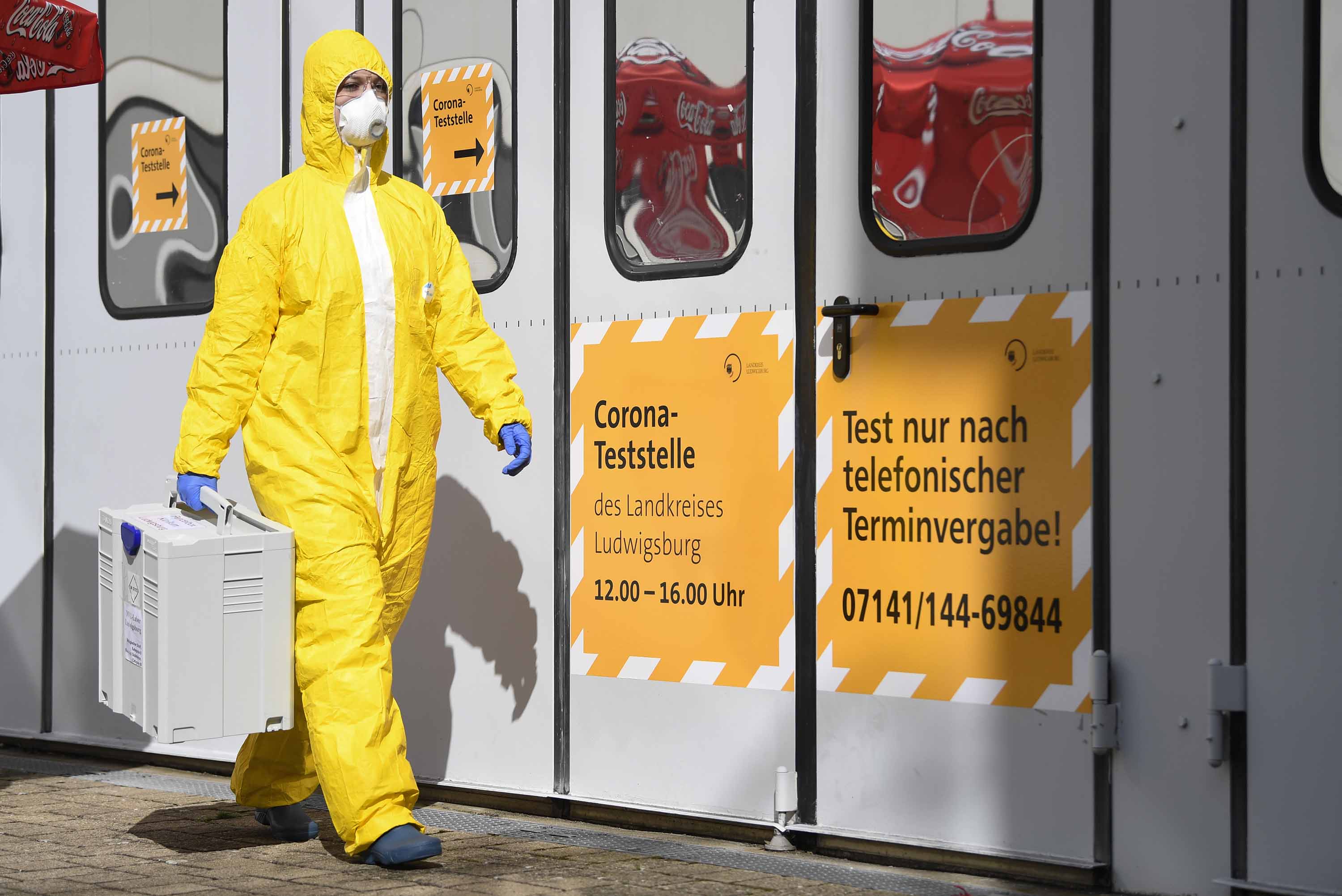 A staff member is seen at a coronavirus test center in Ludwigsburg, Germany, on March 14.