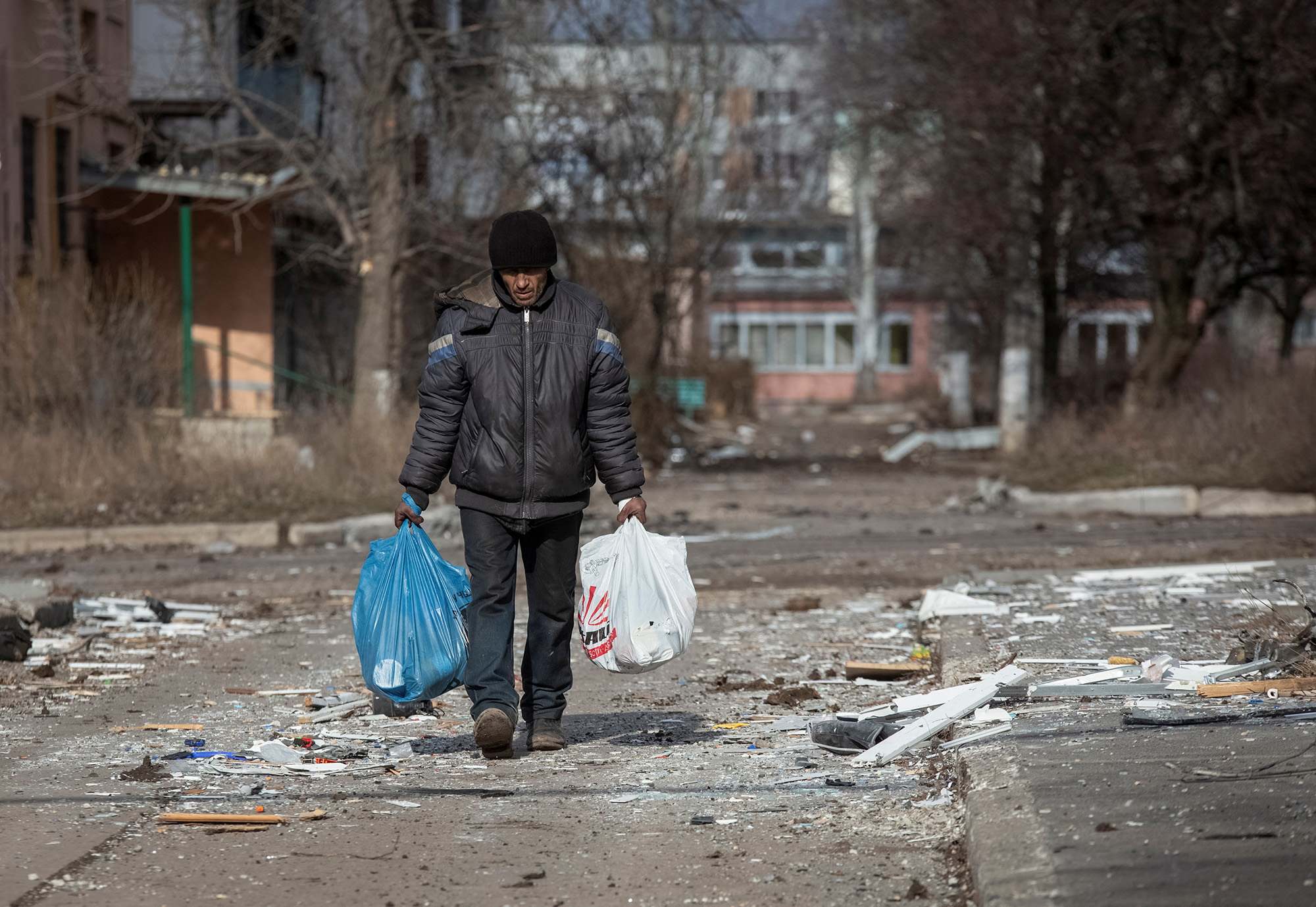A local resident walks on an empty street in the front line city of Bakhmut, Ukraine, on March 3.