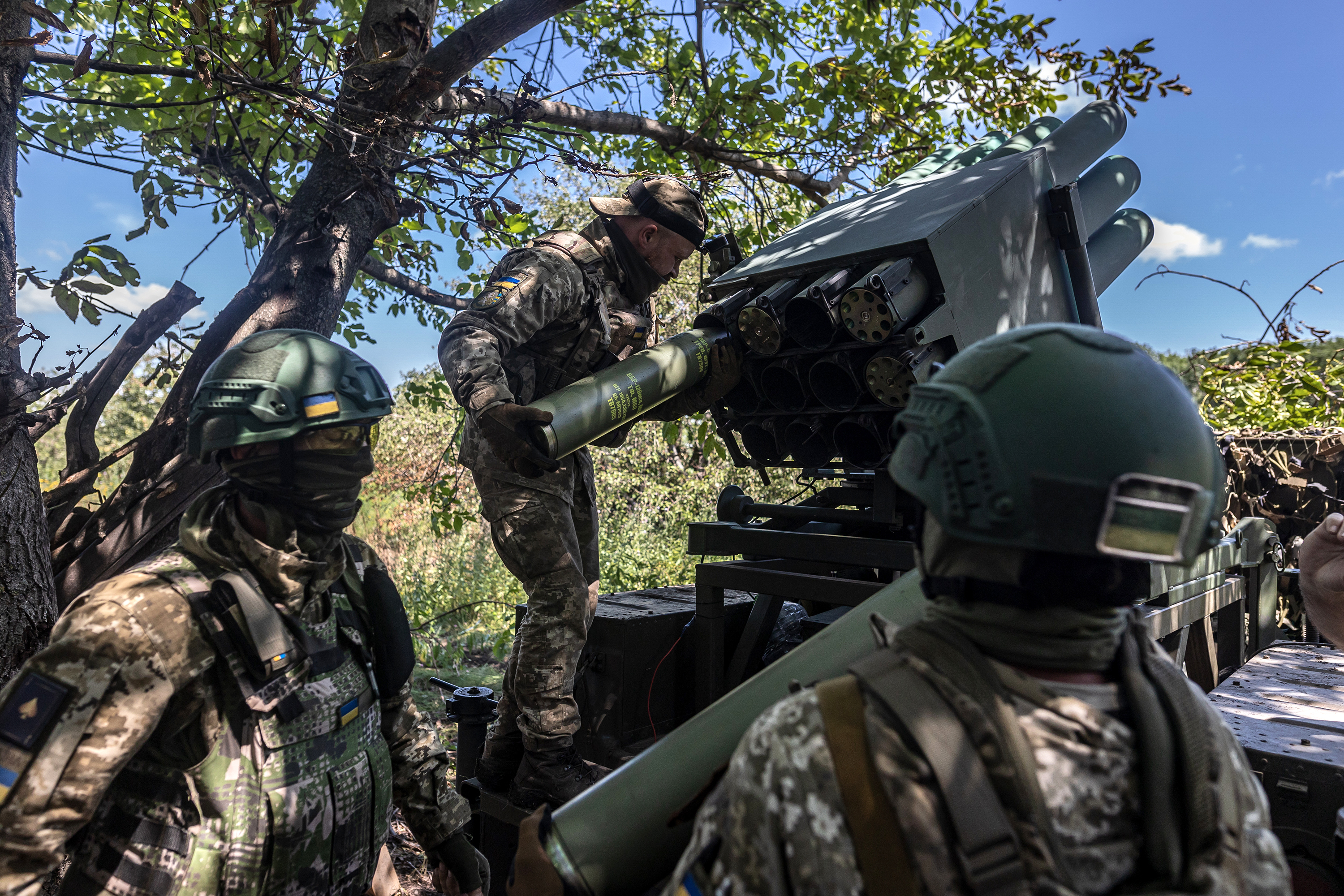  Ukrainian soldiers reload shells near Bakhmut, Ukraine, on July 10. 