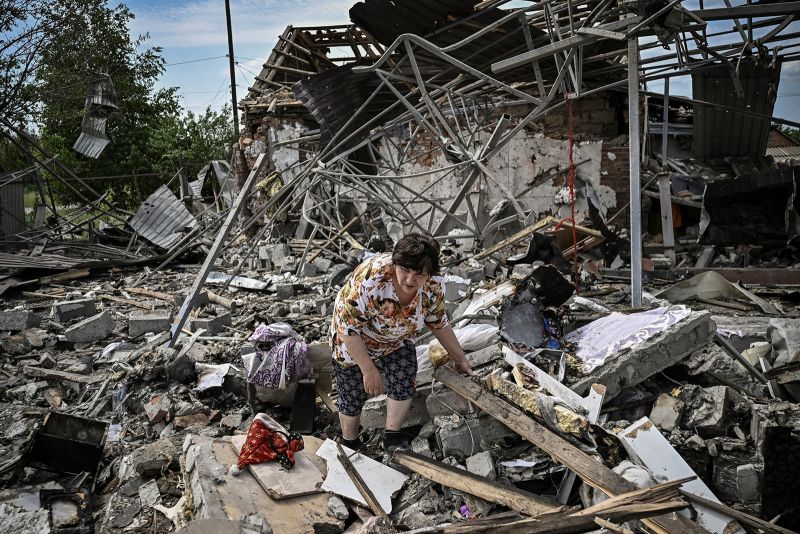 Residents look for belongings in the rubble of their home after a strike destroyed three houses in the city of Sloviansk in the eastern Ukrainian region of Donbas on June 1.