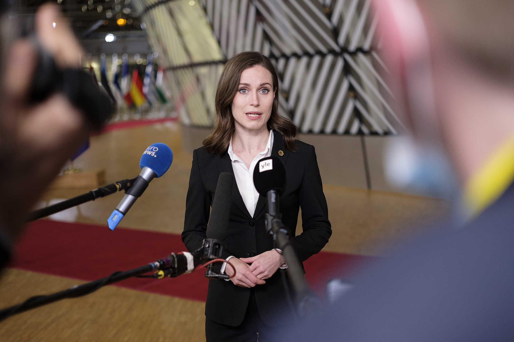 Finish Prime Minister Sanna Marin talks to the media as she arrives at the EU Council headquarters for an EU Summit on the situation in Ukraine on February 24, in Brussels, Belgium.