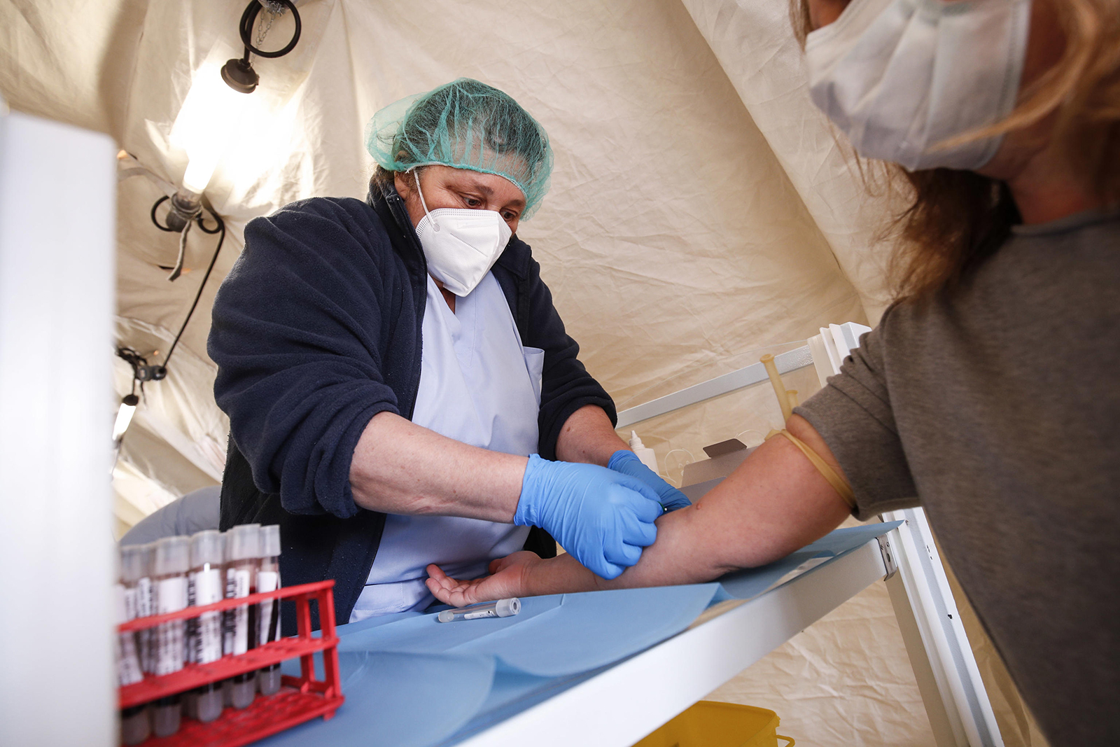 Medical personnel and Italian Red Cross medical staff collect blood samples for Covid-19 serological tests, at San Paolo Hospital in Civitavecchia, near Rome, on May 30.
