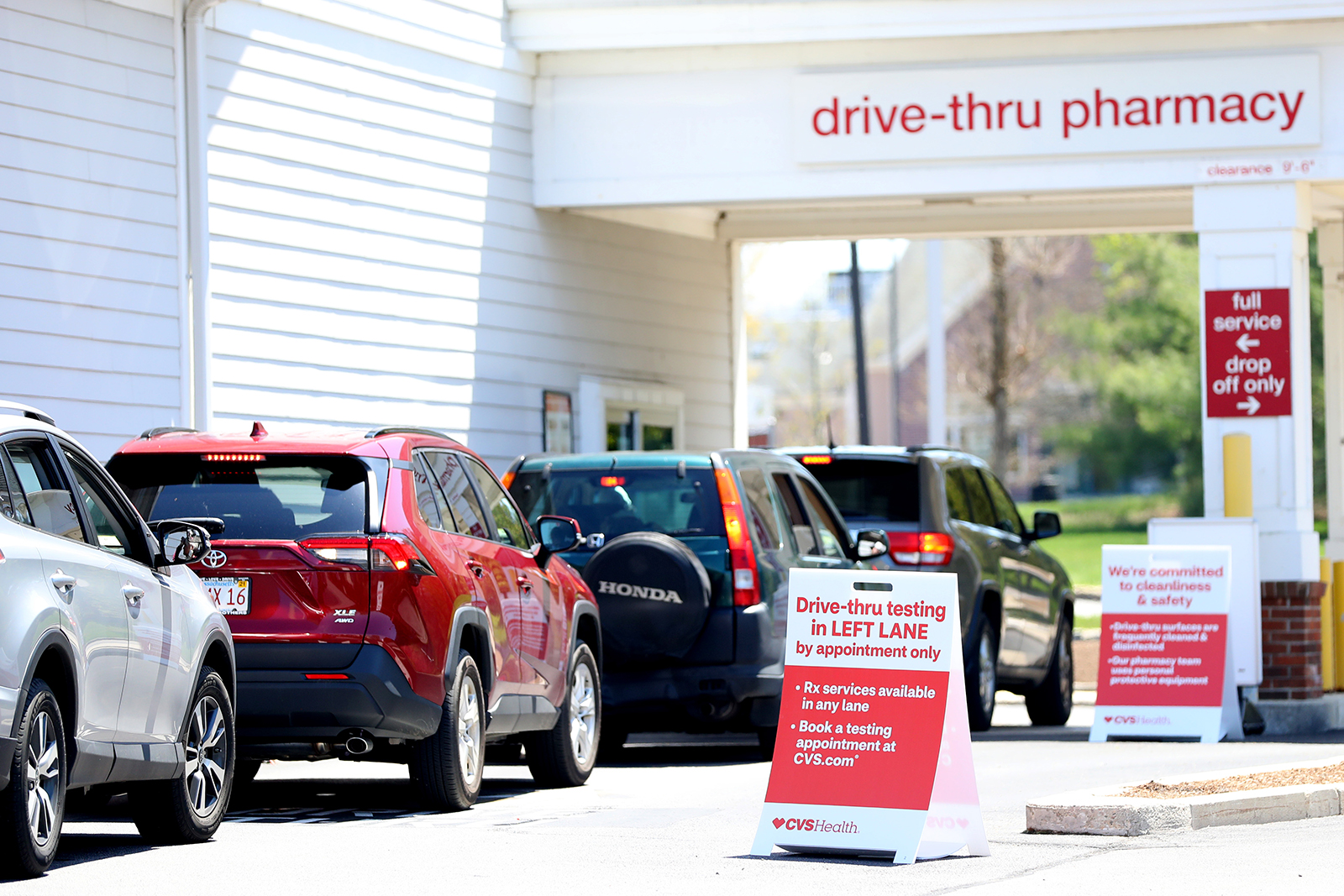Cars line up for a drive-thru coronavirus test at CVS Pharmacy on May 15, in Carver, Massachusetts. 