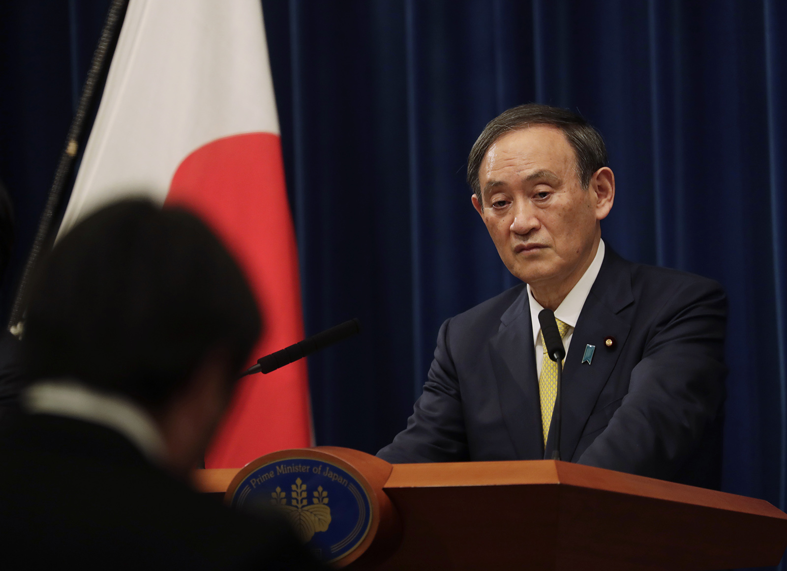Japanese Prime Minister Yoshihide Suga speaks during a news conference in Tokyo on Friday, December 4.
