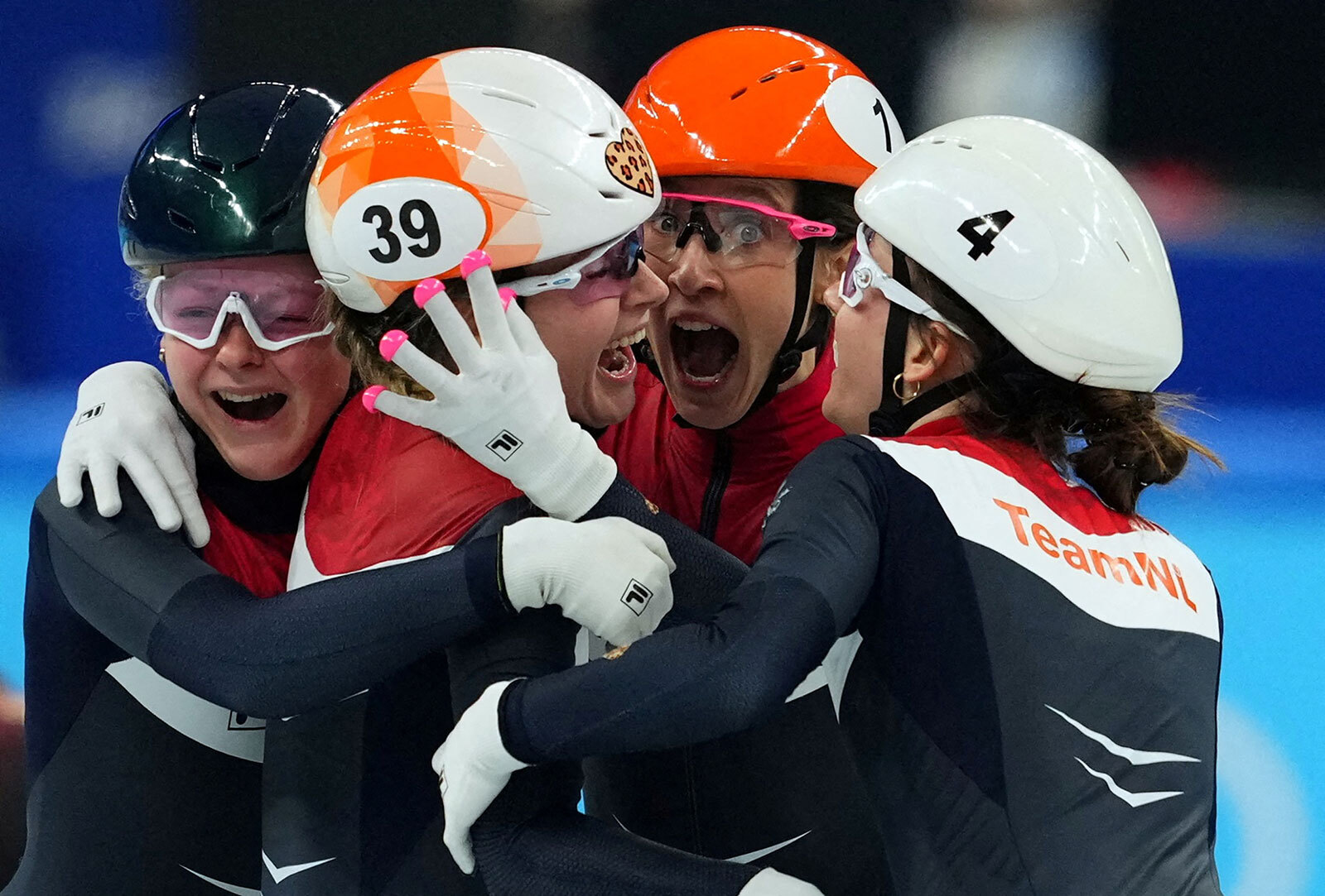 Dutch speed skaters Xandra Velzeboer, Suzanne Schulting, Selma Poutsma and Yara Van Kerkhof celebrate their gold medal in the 3,000m short track relay on February 13, setting an Olympic record in the race.