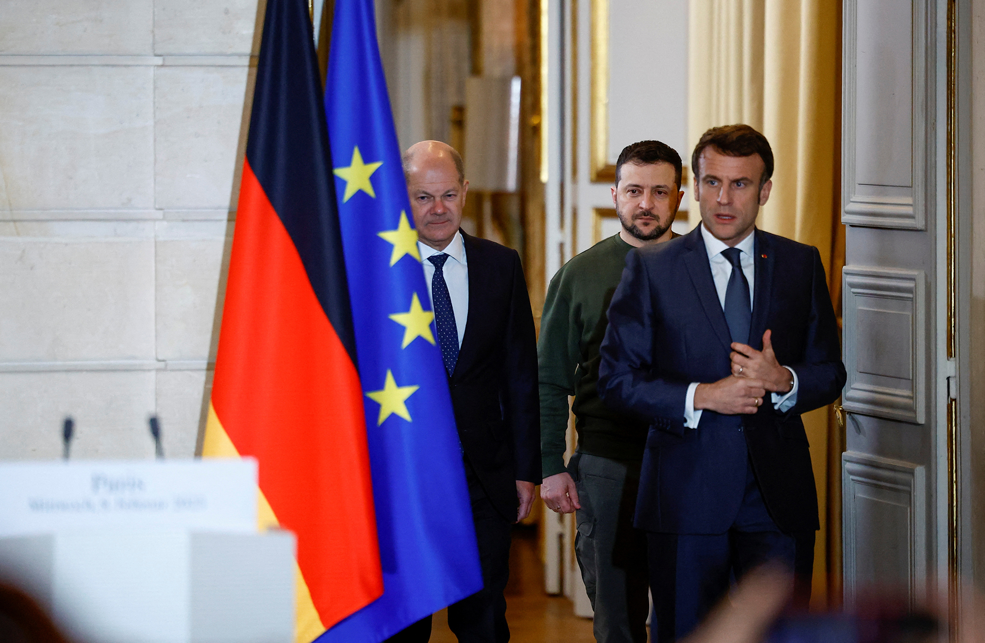 Macron, Zelensky and German Chancellor Olaf Scholz arrive to give a joint statement at the Elysee Palace on February 8.