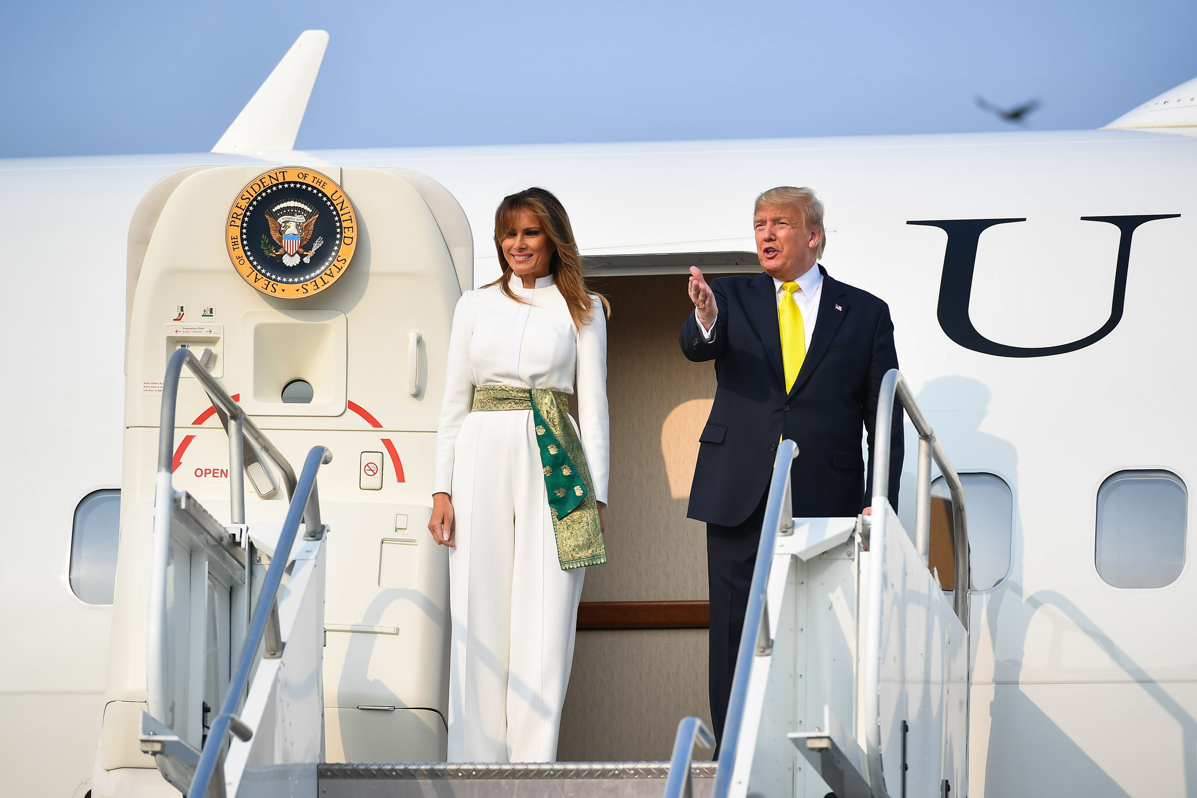 US President Donald Trump and first lady Melania Trump disembark from Air Force One upon their arrival at Agra Air Base on Monday.