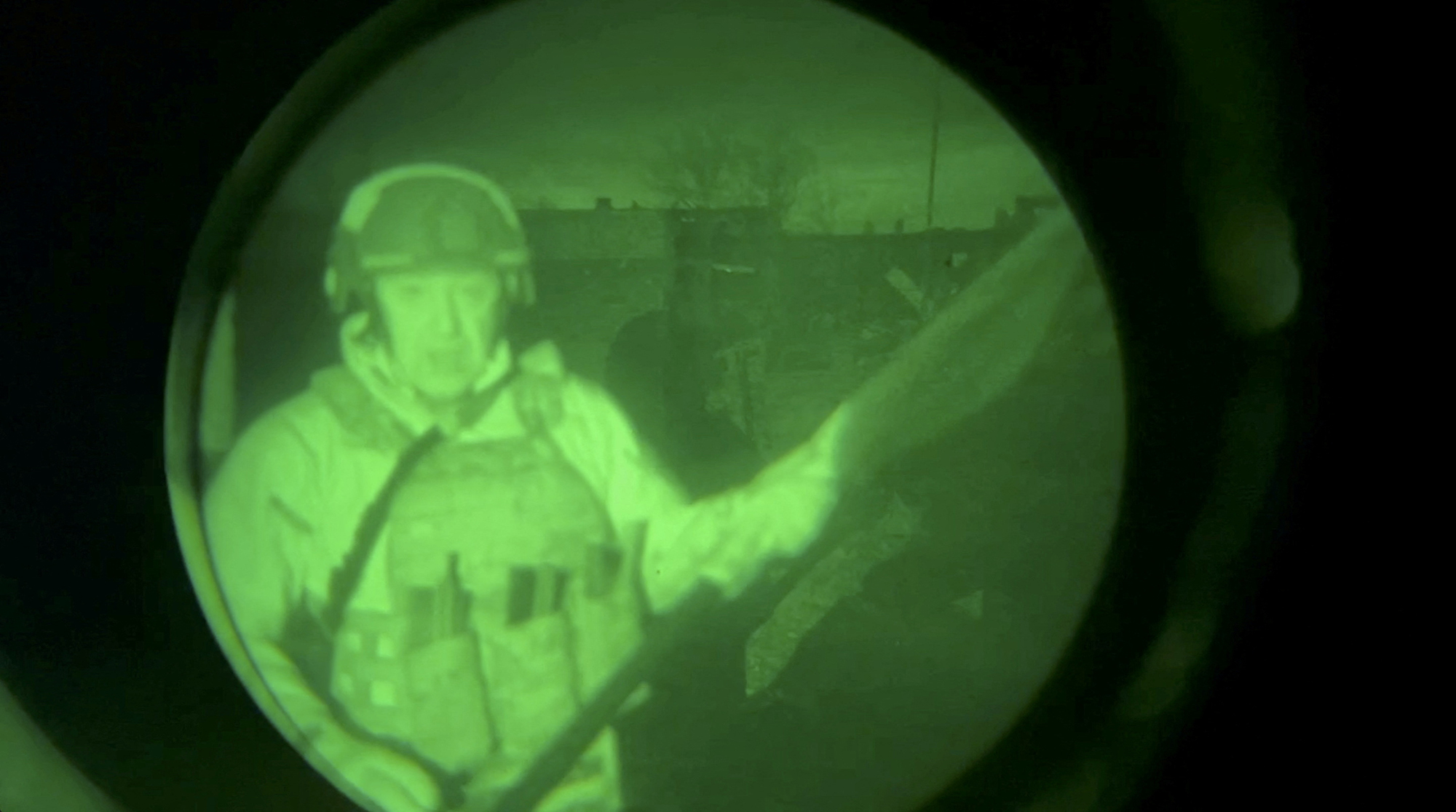 Yevgeny Prigozhin, founder of Russia's Wagner mercenary force, speaks in a video message that was allegedly filmed near the city administration building in Bakhmut, Ukraine, in this still image from an undated video filmed through a night vision device and released on April 3.