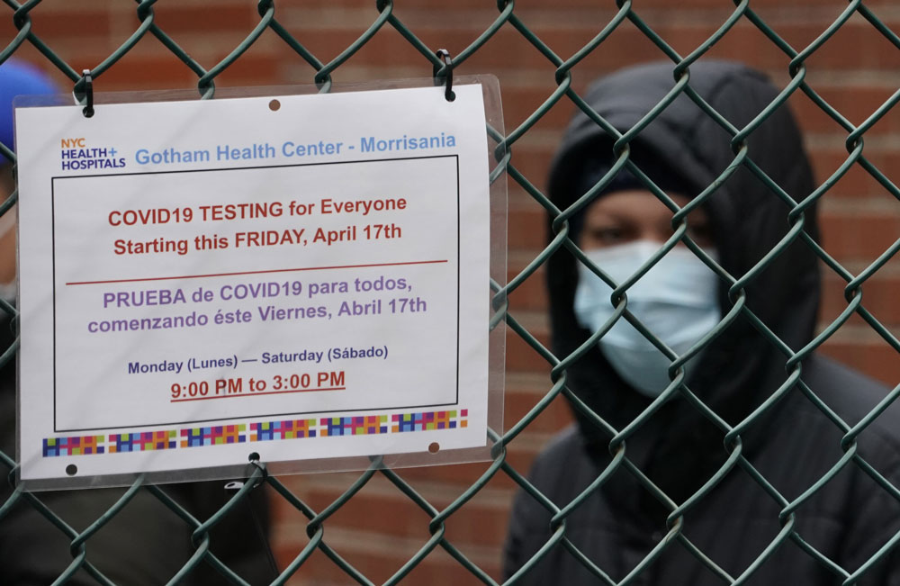 People wait in line for coronavirus tests at one of the walk-in coronavirus testing sites at the NYC Health + Hospitals/Gotham Health Morrisania in the Bronx on April 20.