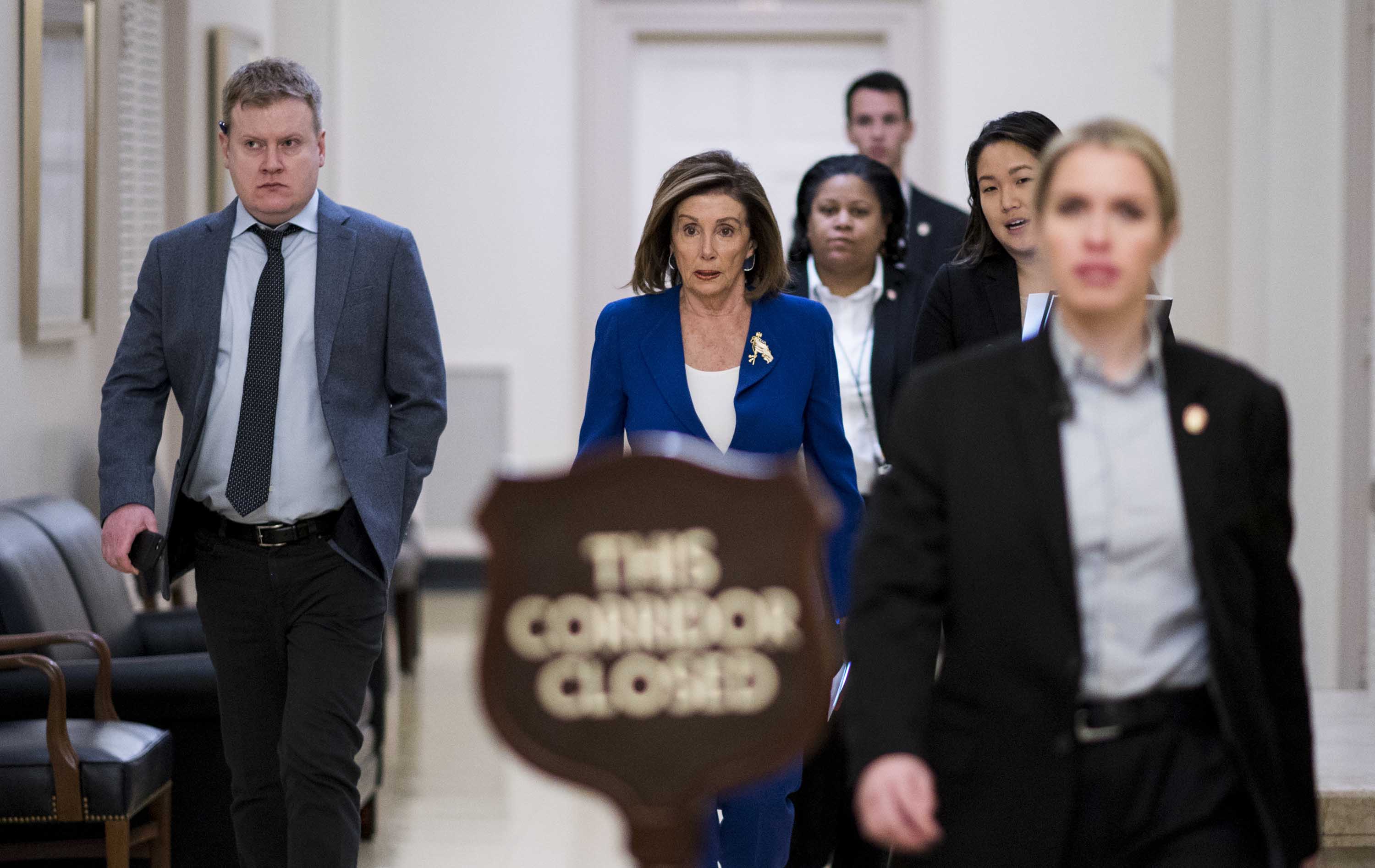 Speaker of the House Nancy Pelosi walks to the House Democrats caucus meeting in the Capitol on Wednesday.