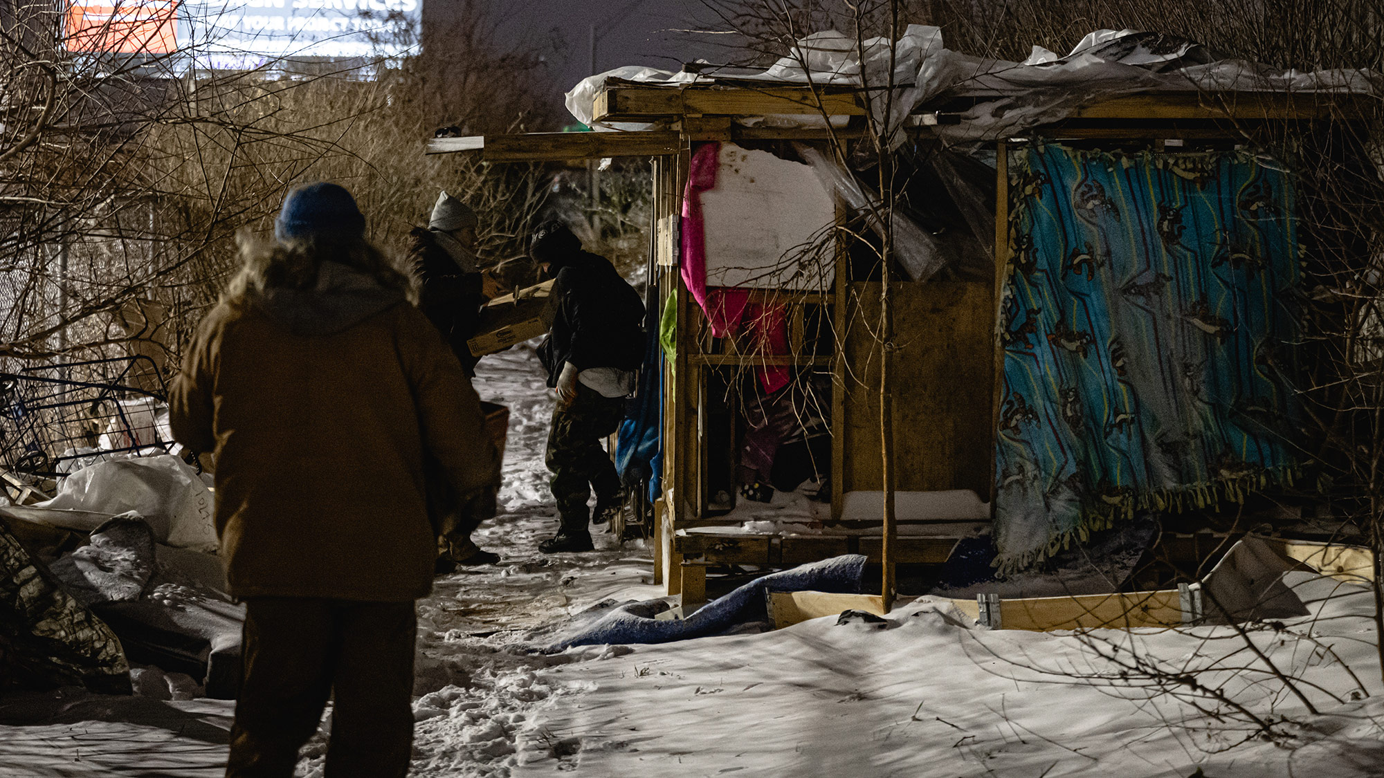An outreach worker delivers supplies to people living in a homeless camp in Louisville, Kentucky, on December 23. 