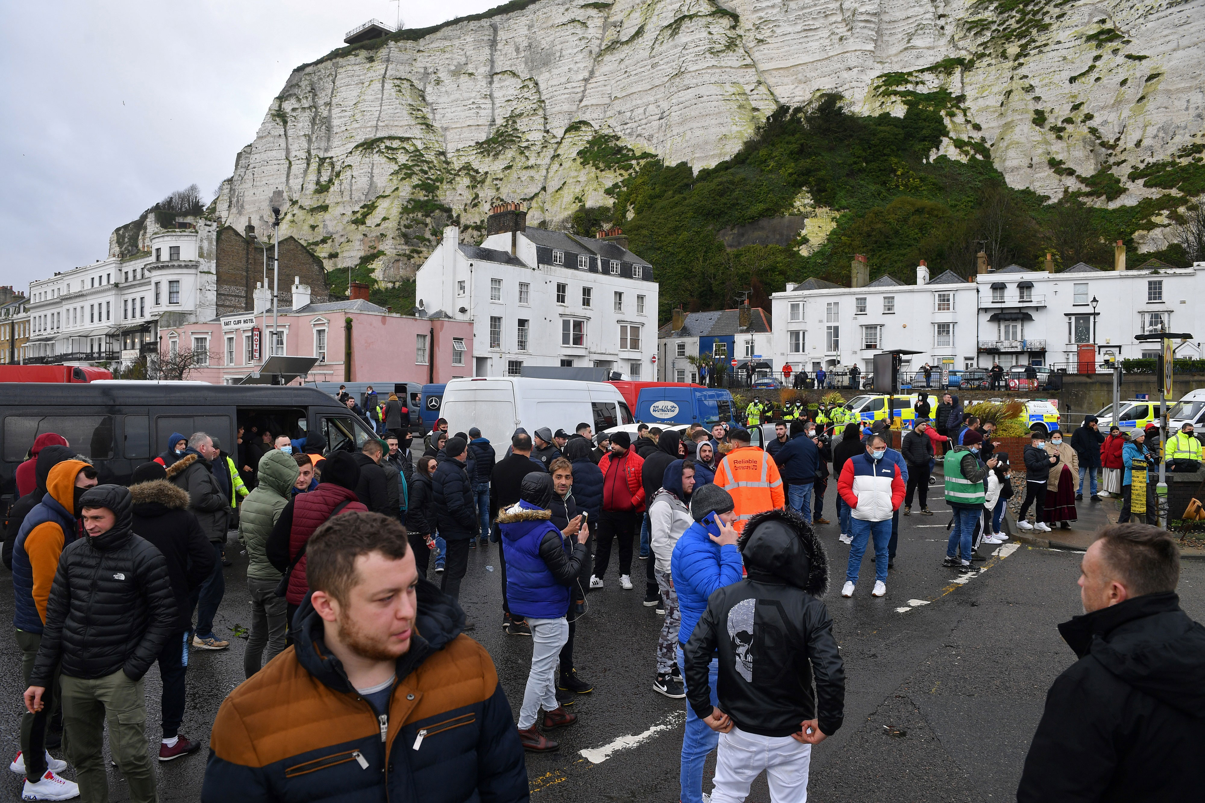 People stand at the blocked entrance to the Port of Dover in Kent, England, on December 23.
