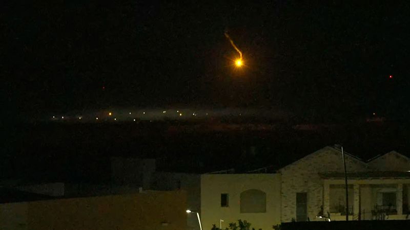 Several illumination flares were seen floating down in the distance while red tracer rounds can be seen accompanied by the sound of heavy machine gun fire. 