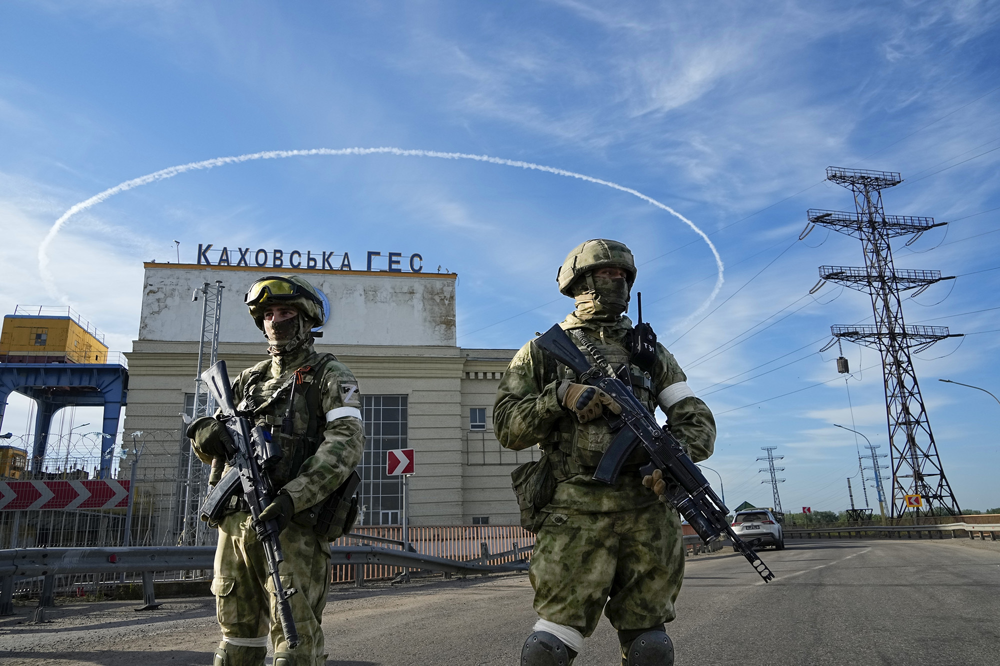 Russian troops guard an entrance of the Kakhovka Hydroelectric Station, a run-of-the-river power plant on the Dnieper River in Kherson region, southern Ukraine, on May 20.