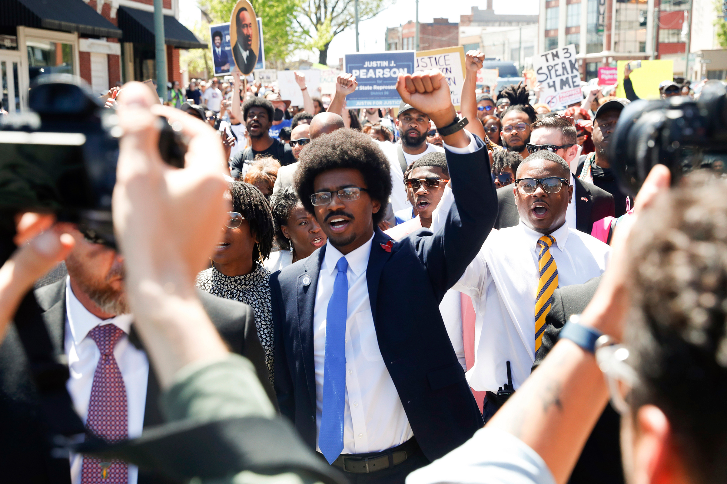 Justin Pearson and his supporters march to the Shelby County Board of Commissioners meeting in Memphis on Wednesday.