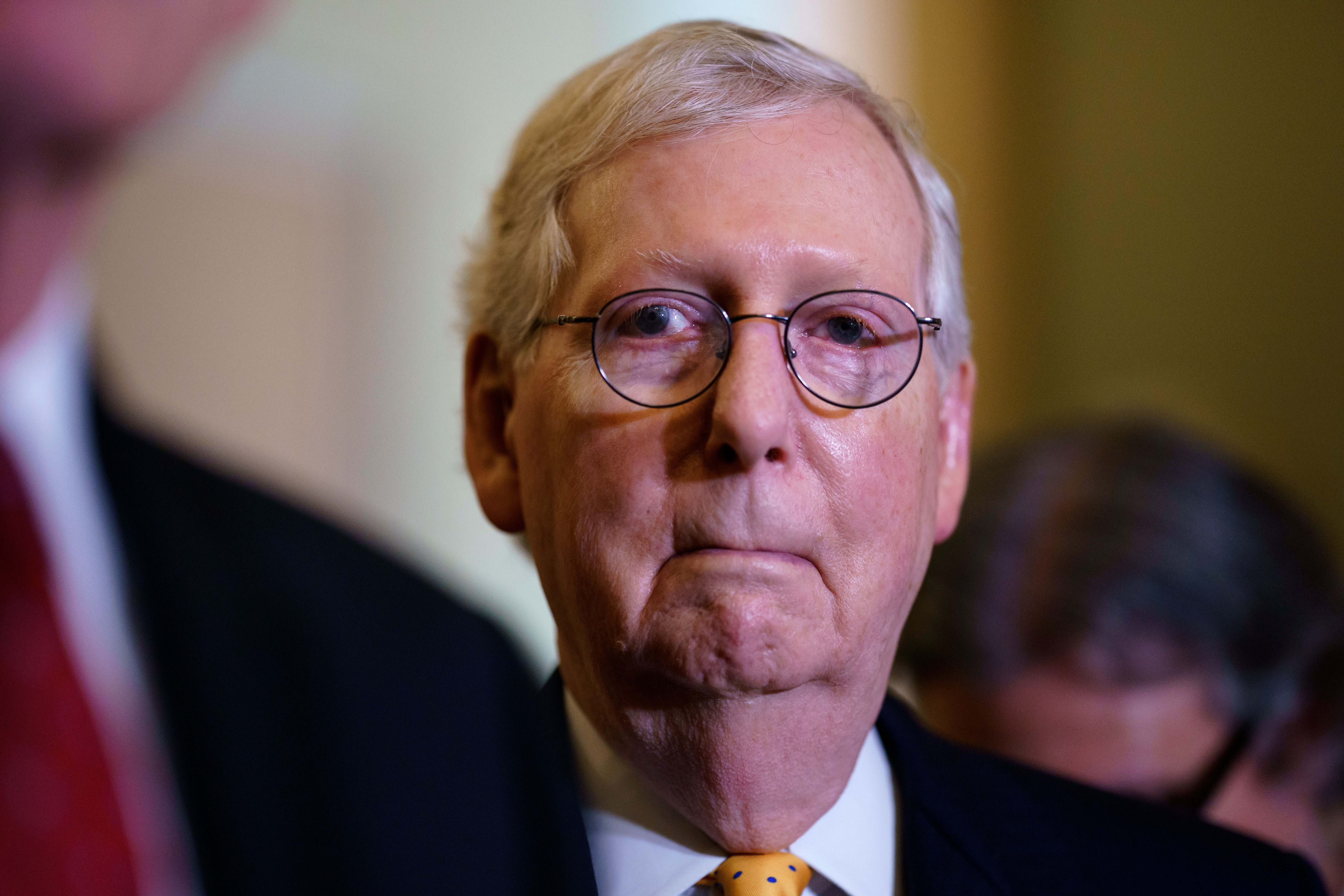 Senate Republican Leader Mitch McConnell listens during a news conference with reporters at the US Capitol in Washington, DC, on July 27, 2021.