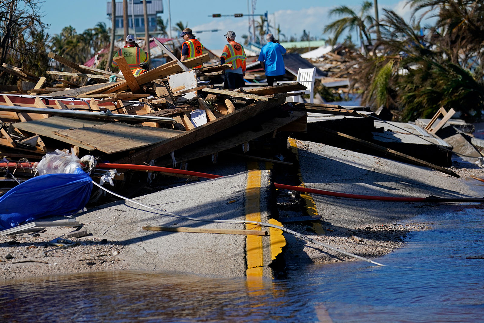 Responders survey damage to the bridge leading to Pine Island in Matlacha, Florida on Sunday, October 2. 