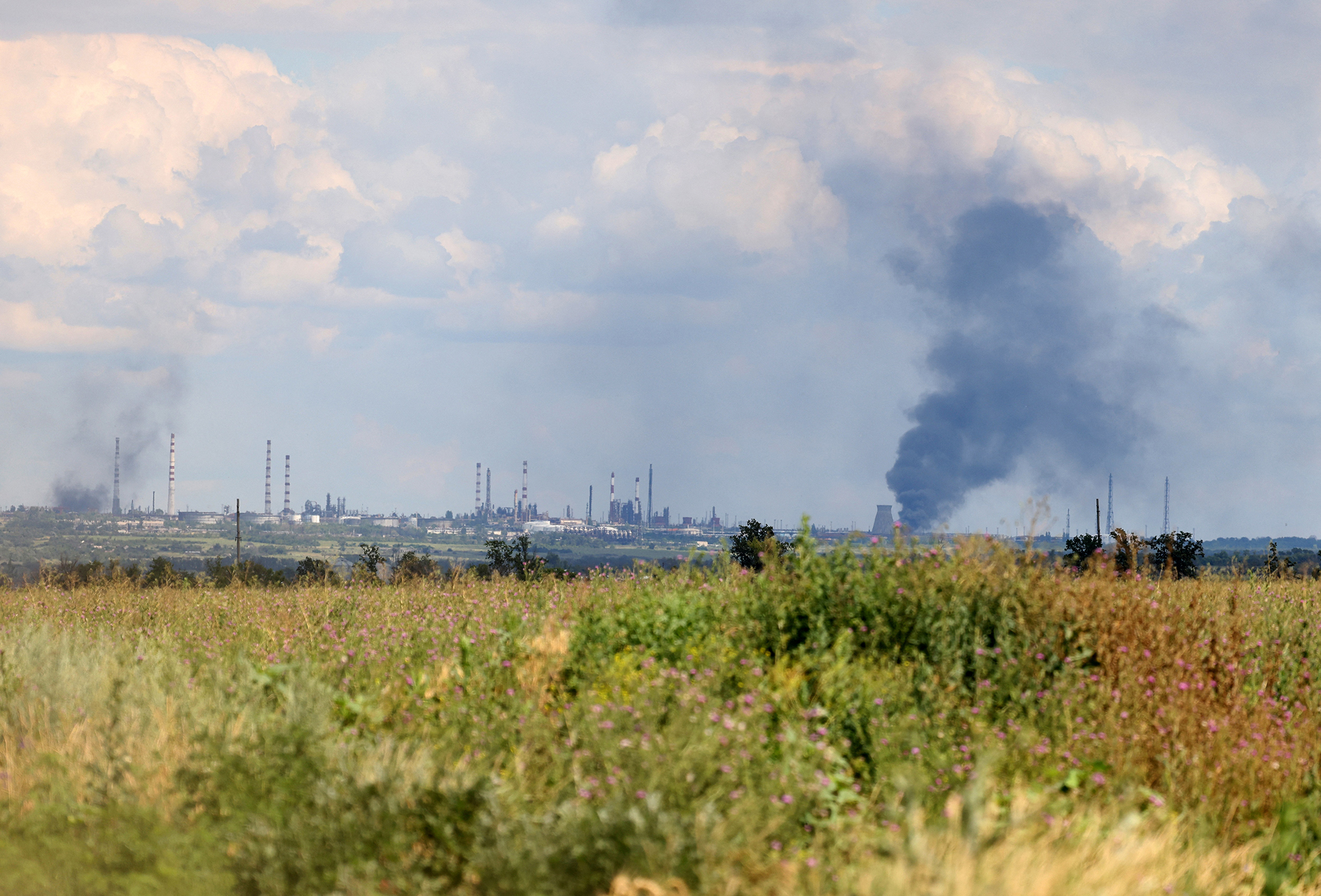 Smoke rises above a town in Luhansk region, Ukraine, on July 12. 