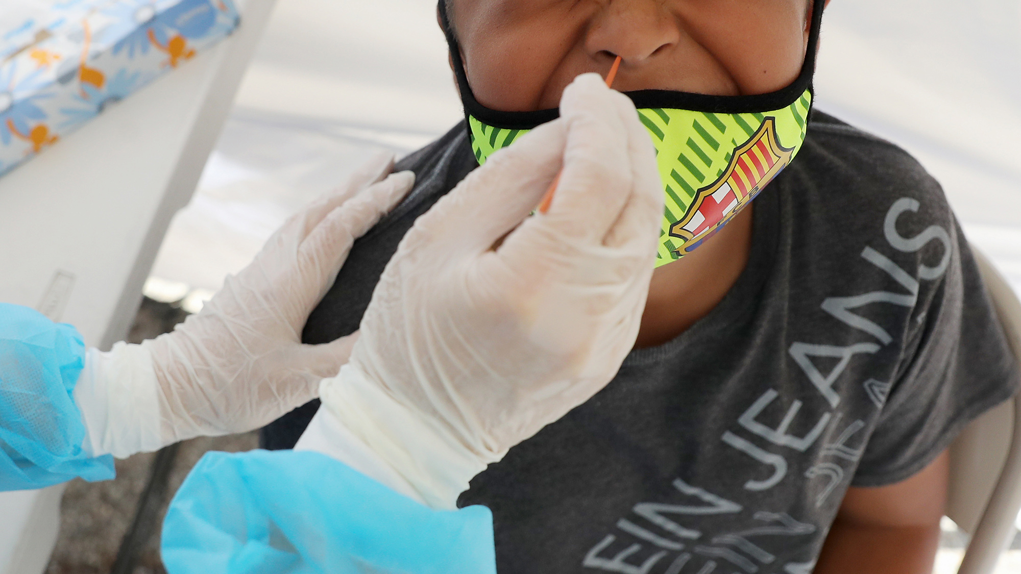 A boy receives a free Covid-19 test at a St. John's Well Child & Family Center clinic outside of Walker Temple AME Church in Los Angeles on July 15. 