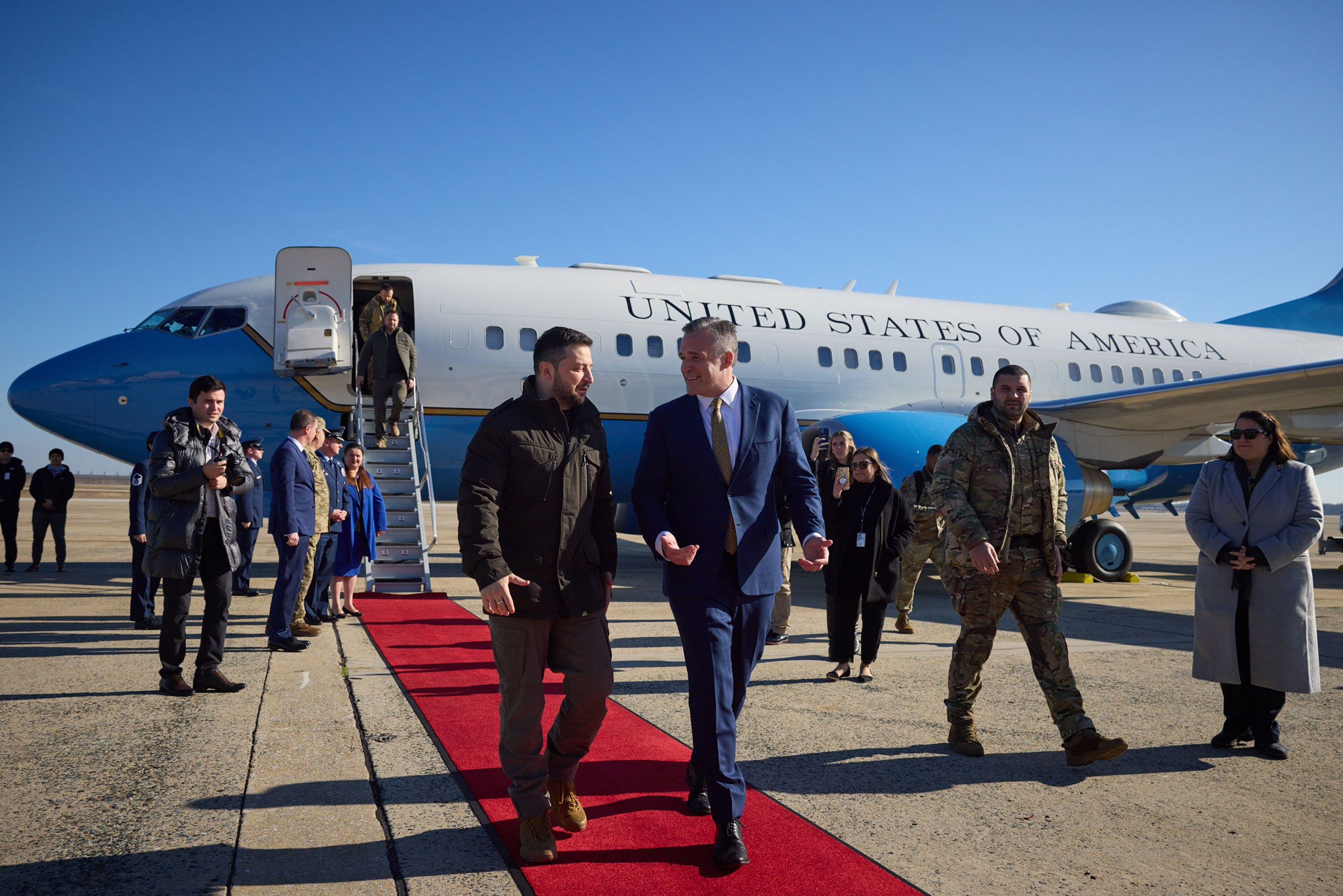 Ukrainian President Volodymyr Zelensky, left, is greeted by US chief of protocol Rufus Gifford after landing in the United States on Wednesday.