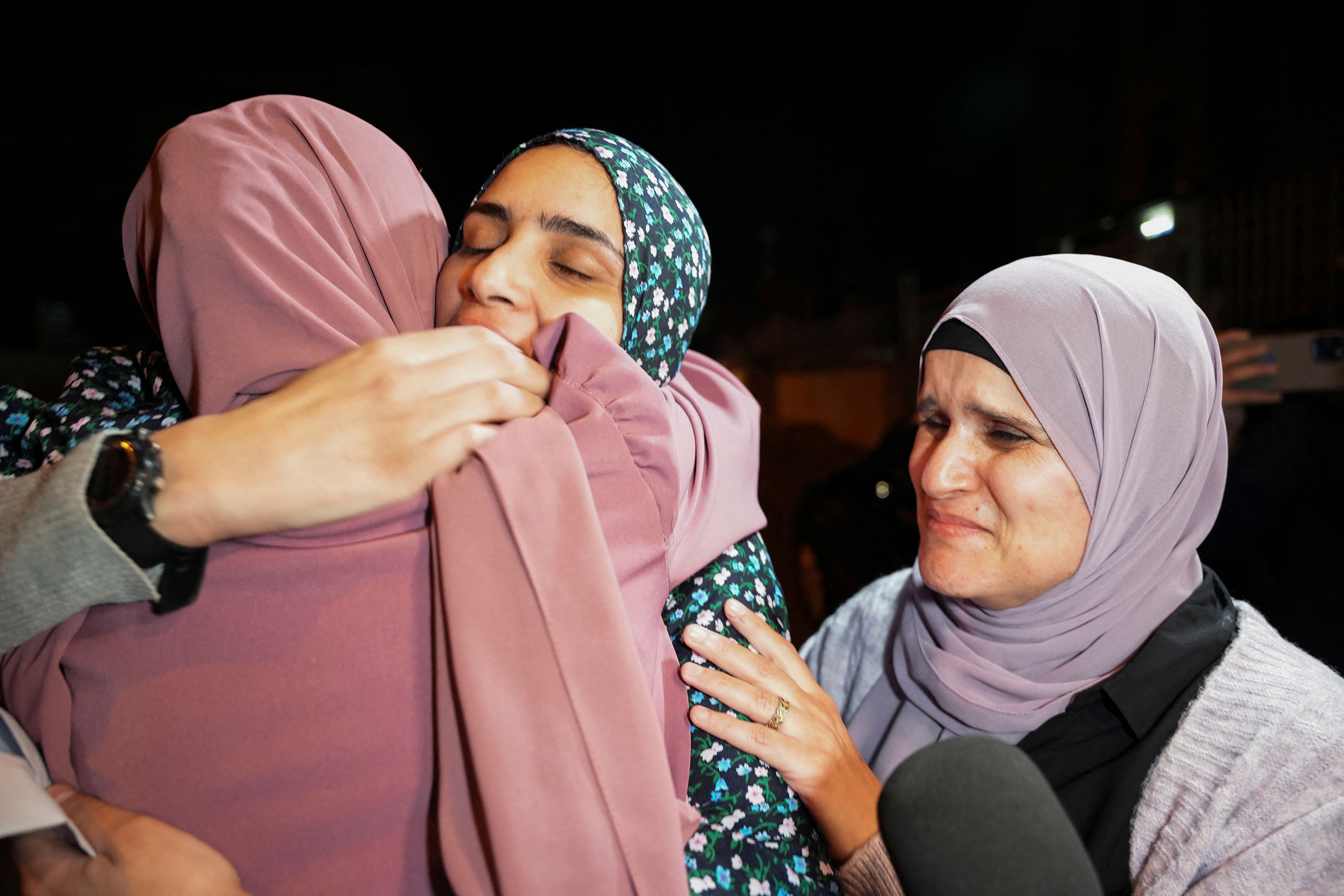 Released Palestinian prisoner Marah Bkeer embraces her family near her home in Jerusalem after being released in the hostages-prisoners swap deal between Hamas and Israel on November 24.