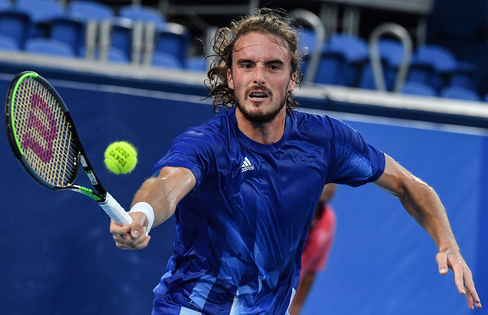 Greece's Stefanos Tsitsipas returns a shot to Germany's Philipp Kohlschreiber during their tennis match on July 25.