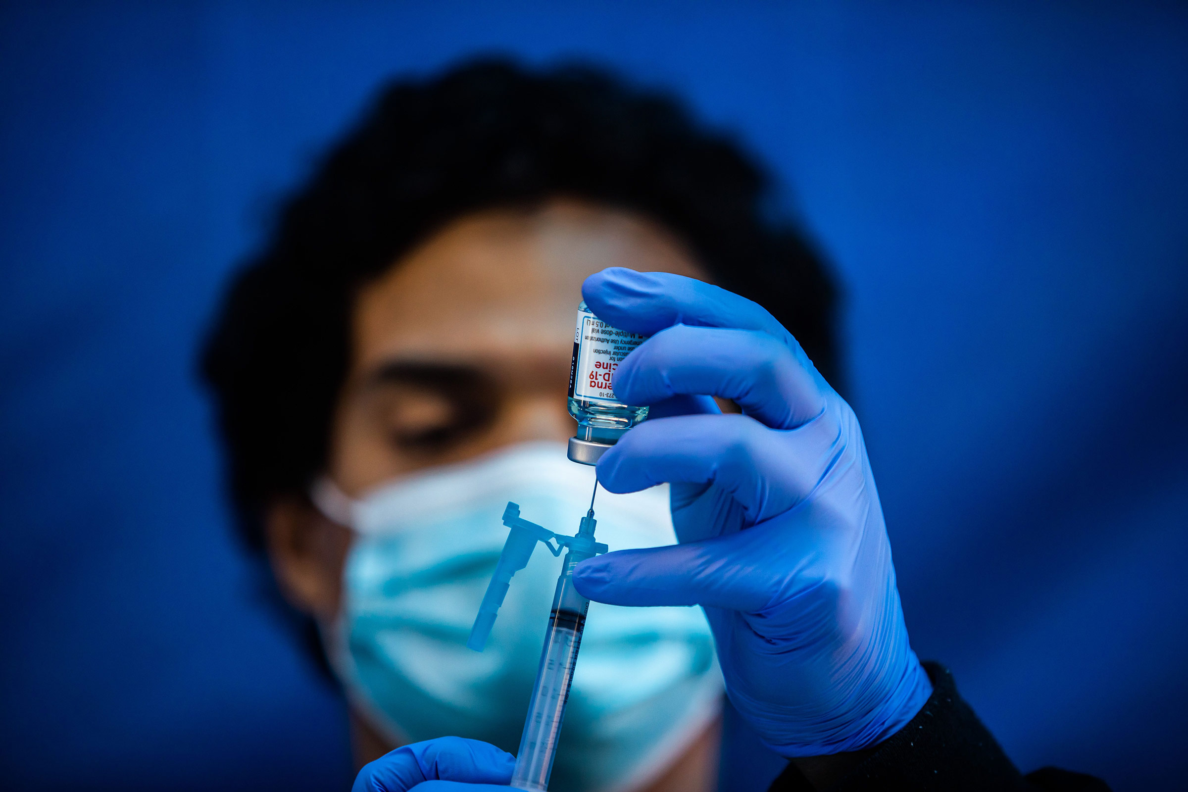 Medical worker Robert Gilbertson loads a syringe with the Moderna Covid-19 vaccine at a vaccination site in Los Angeles on February 16. 