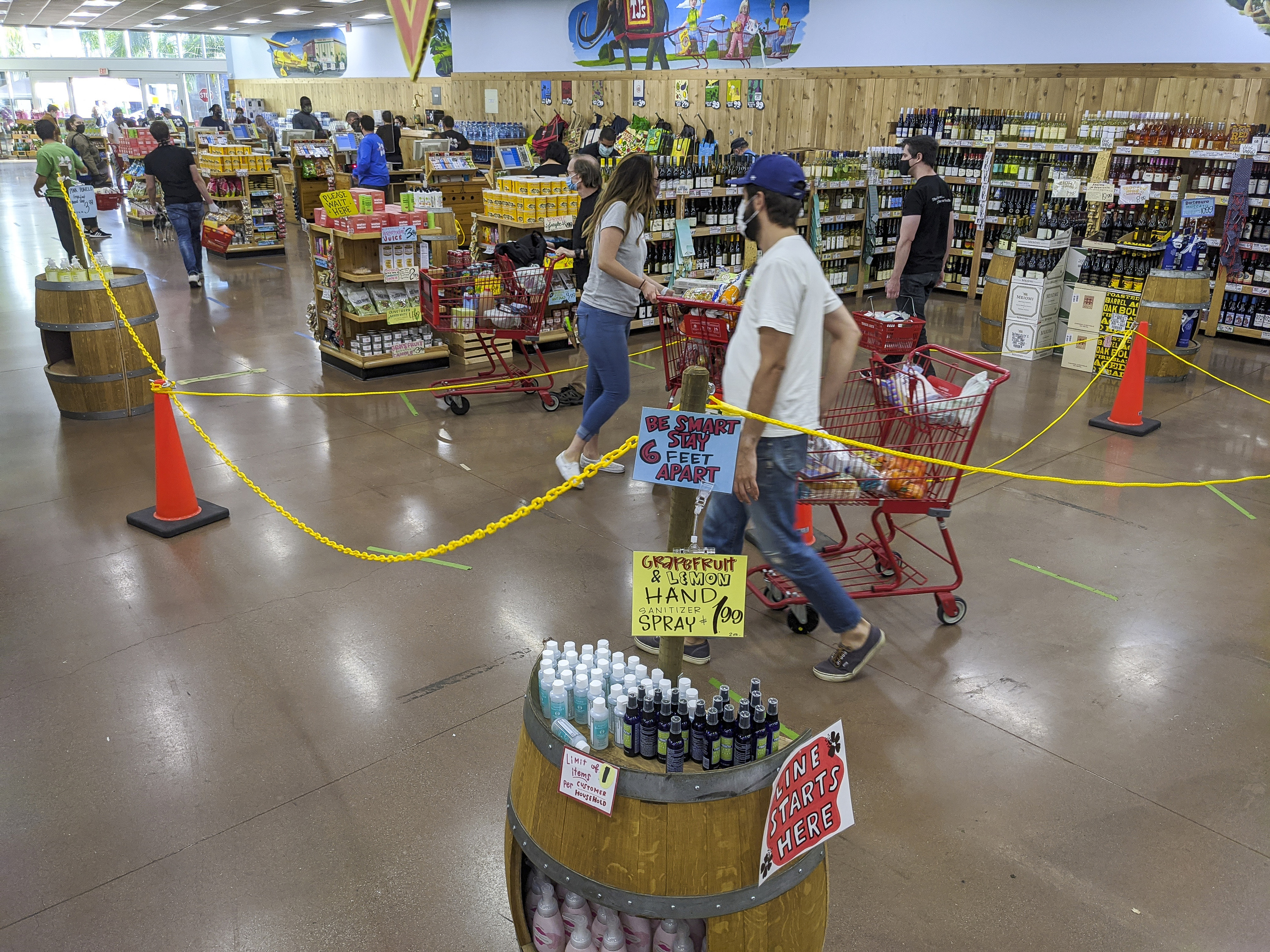 Customers wear protective masks and follow social distancing guidelines as they shop at a Trader Joe's in Los Angeles on May 14.