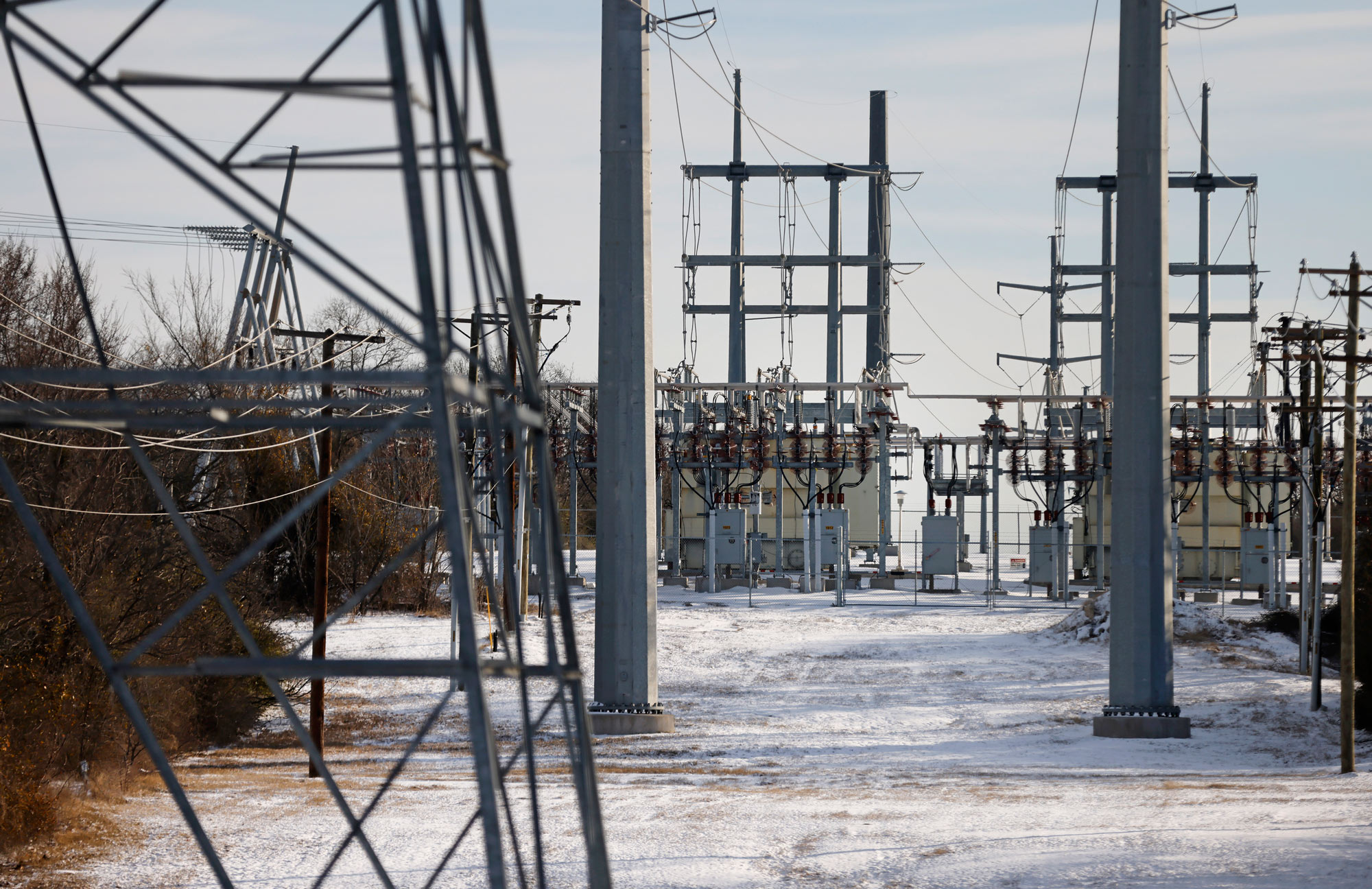 Transmission towers and power lines lead to a substation on February 16 in Fort Worth, Texas. 