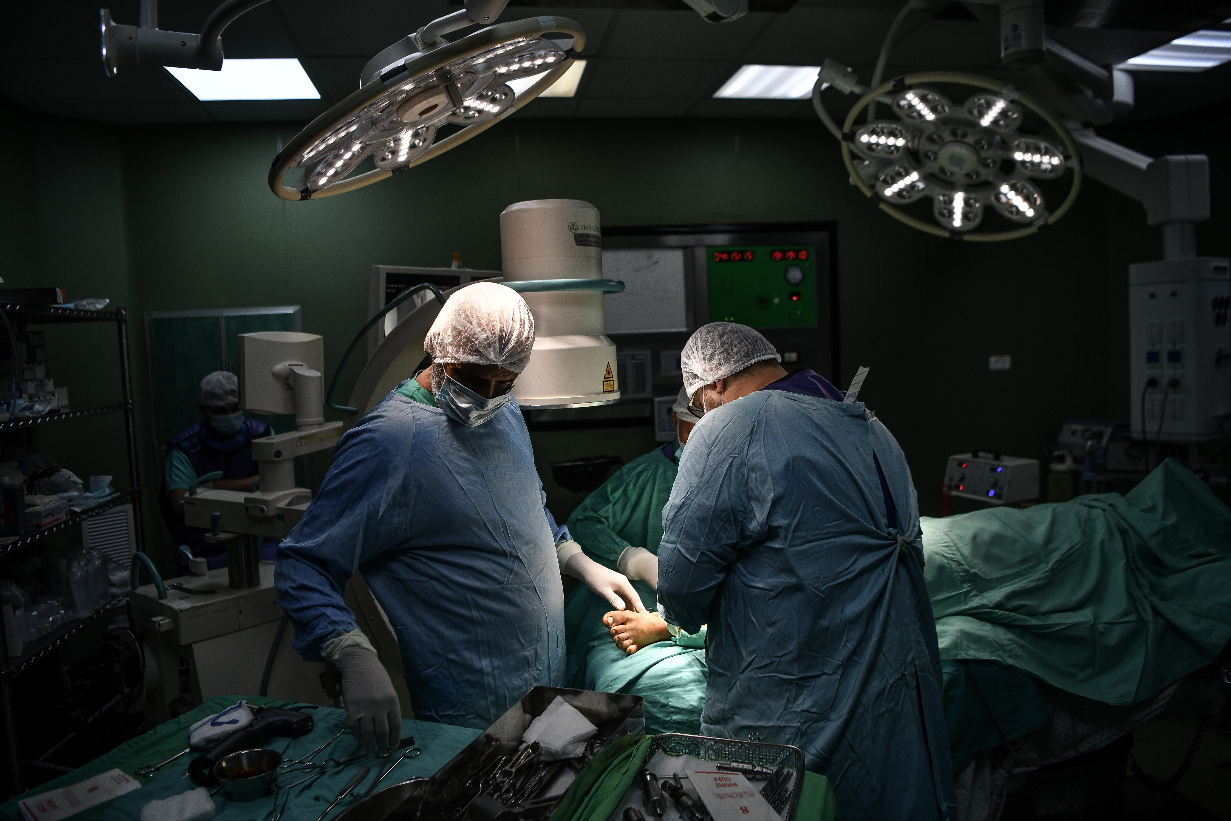 Surgeons operate on a Palestinian man injured during Israeli attacks, at Nasser Hospital in Khan Younis, Gaza, on November 16.