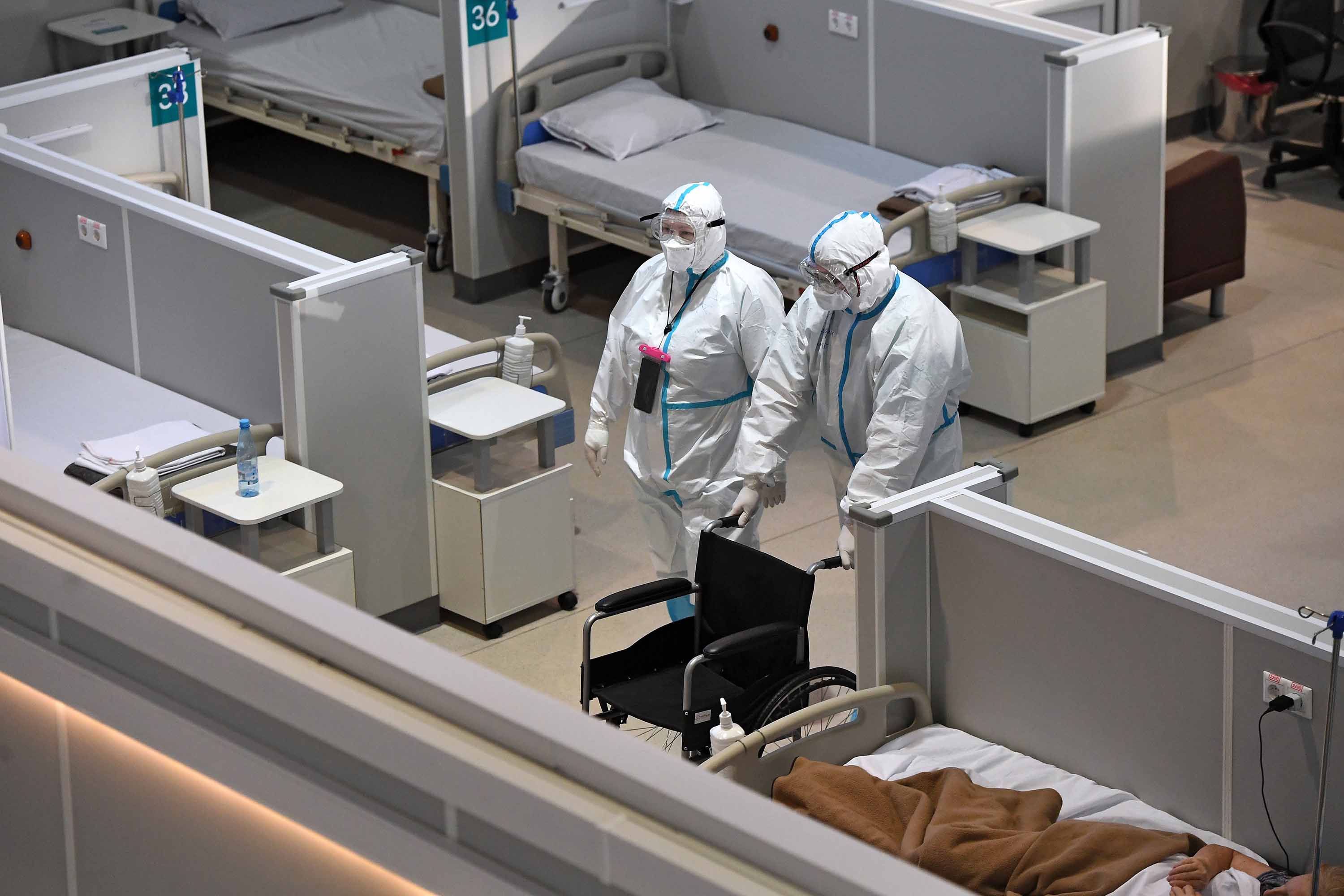 Medical personnel work at the Sokolniki Exhibition and Convention Center, which has been converted into a field hospital for coronavirus patients, in Moscow, Russia, on October 29.