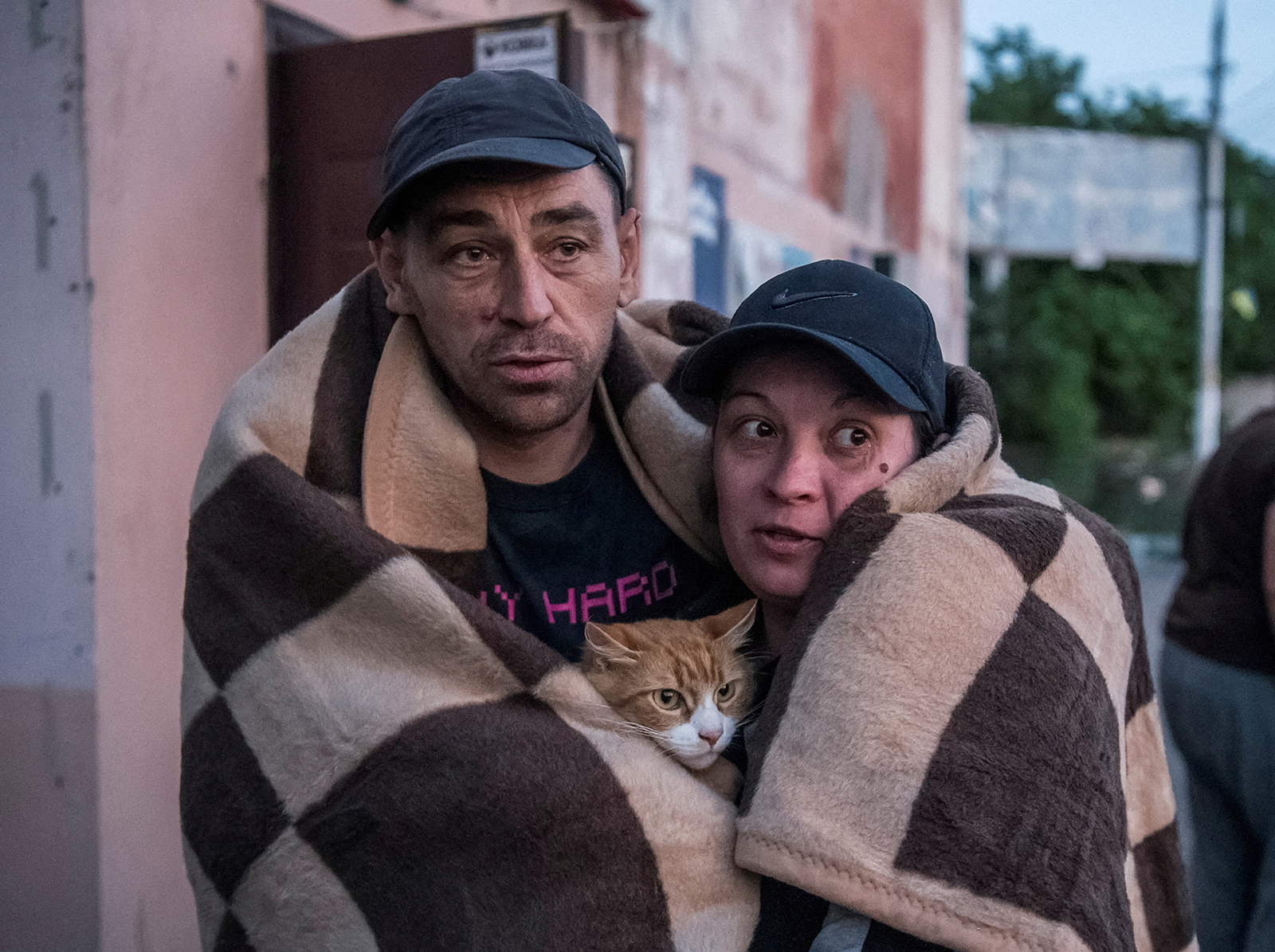 Local residents react after evacuating from a flooded area in Kherson, Ukraine on June 6.