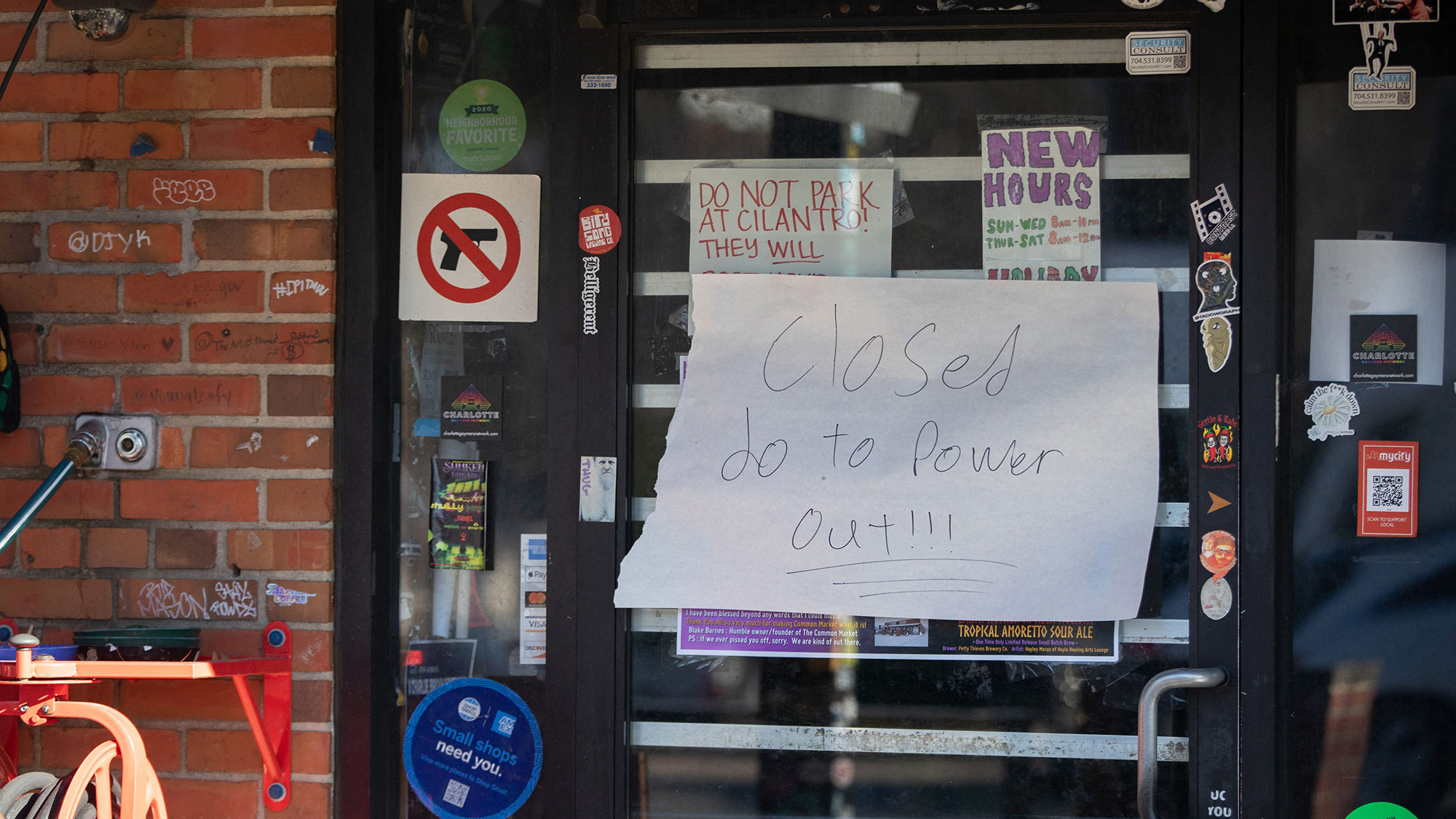A sign informs shoppers that a store is closed due to a widespread power outage in Charlotte, North Carolina, on Dec. 24.