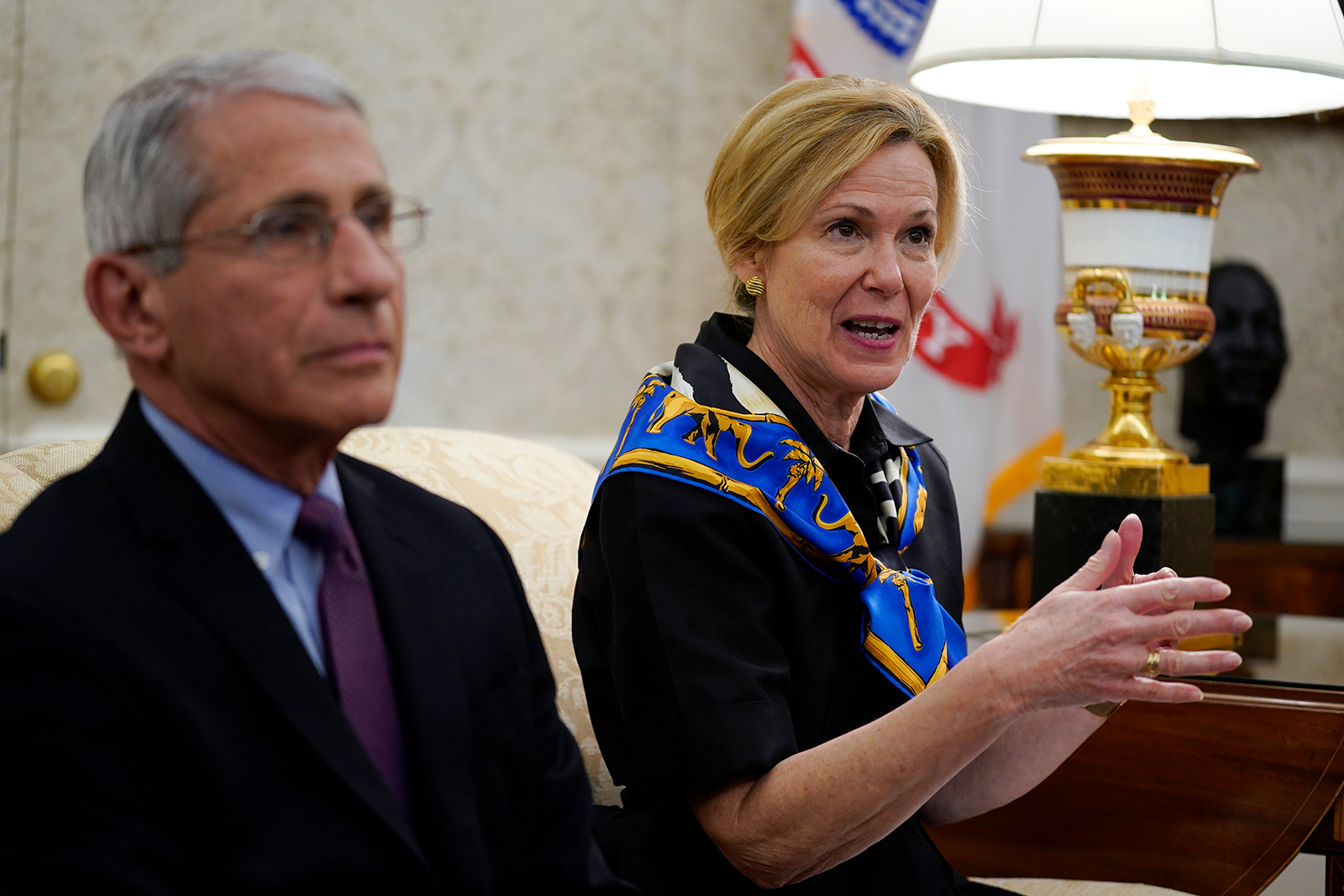 White House coronavirus response coordinator Dr. Deborah Birx, right, speaks as Director of the National Institute of Allergy and Infectious Diseases Dr. Anthony Fauci listens during a meeting about the coronavirus in the Oval Office on Wednesday, April 29.
