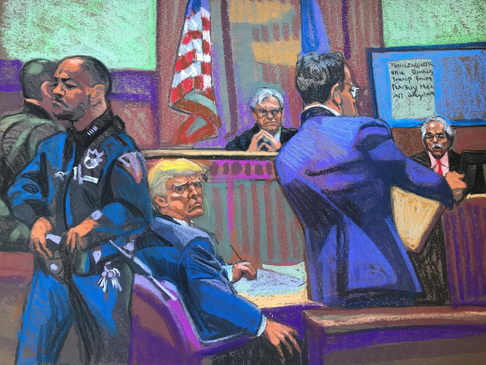Trump sits in the courtroom.