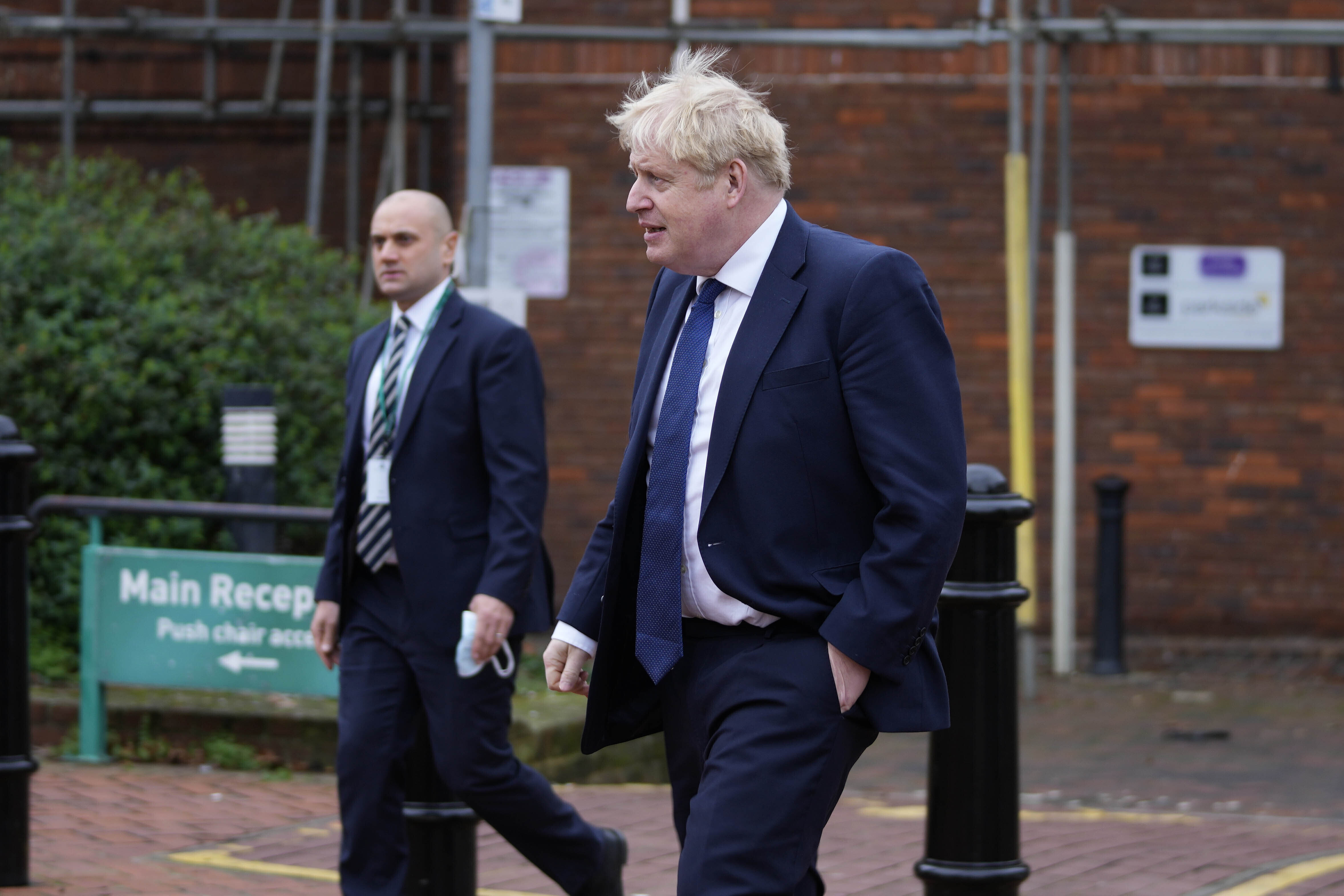 Britain's Prime Minister Boris Johnson leaves a vaccination centre at a pharmacy in his constituency Uxbridge, in London on Monday.