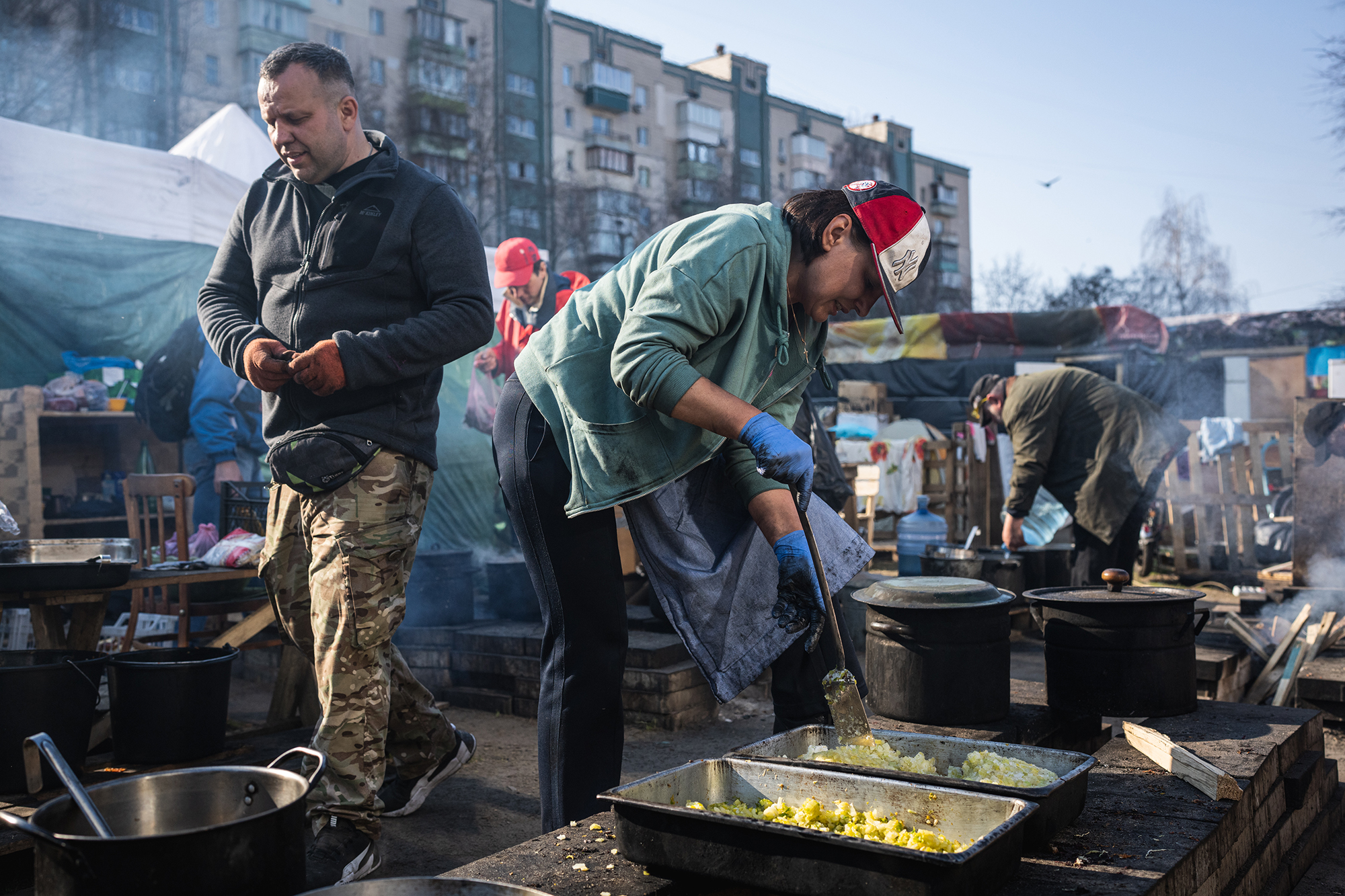 Volunteers are seen preparing and distributing food for locals and the territorial defense in Kyiv, Ukraine, on March 25.