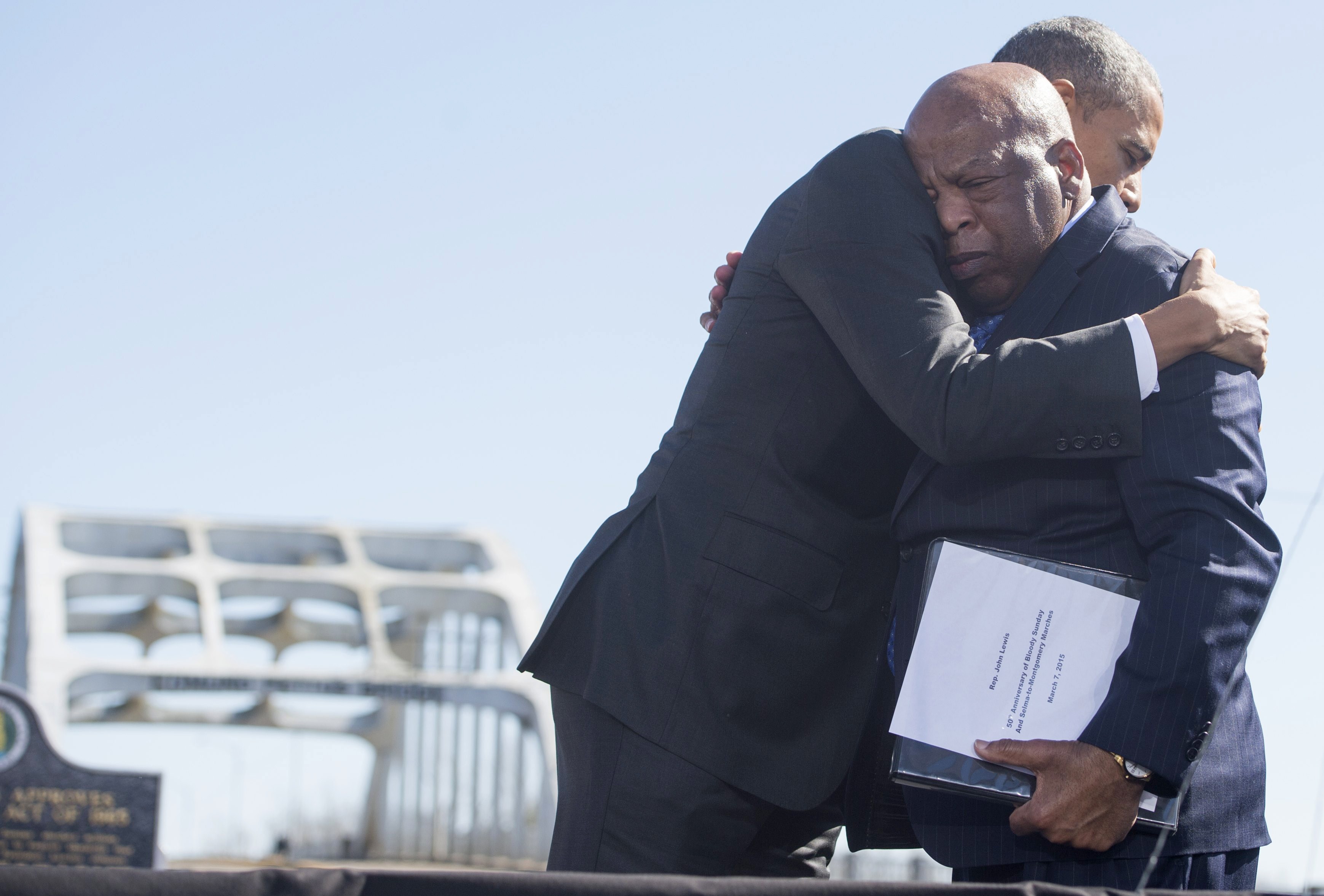 US President Barack Obama hugs Congressman John Lewis, during an event marking the 50th Anniversary of the Selma to Montgomery civil rights marches at the Edmund Pettus Bridge in Selma, Alabama, on March 7, 2015. 