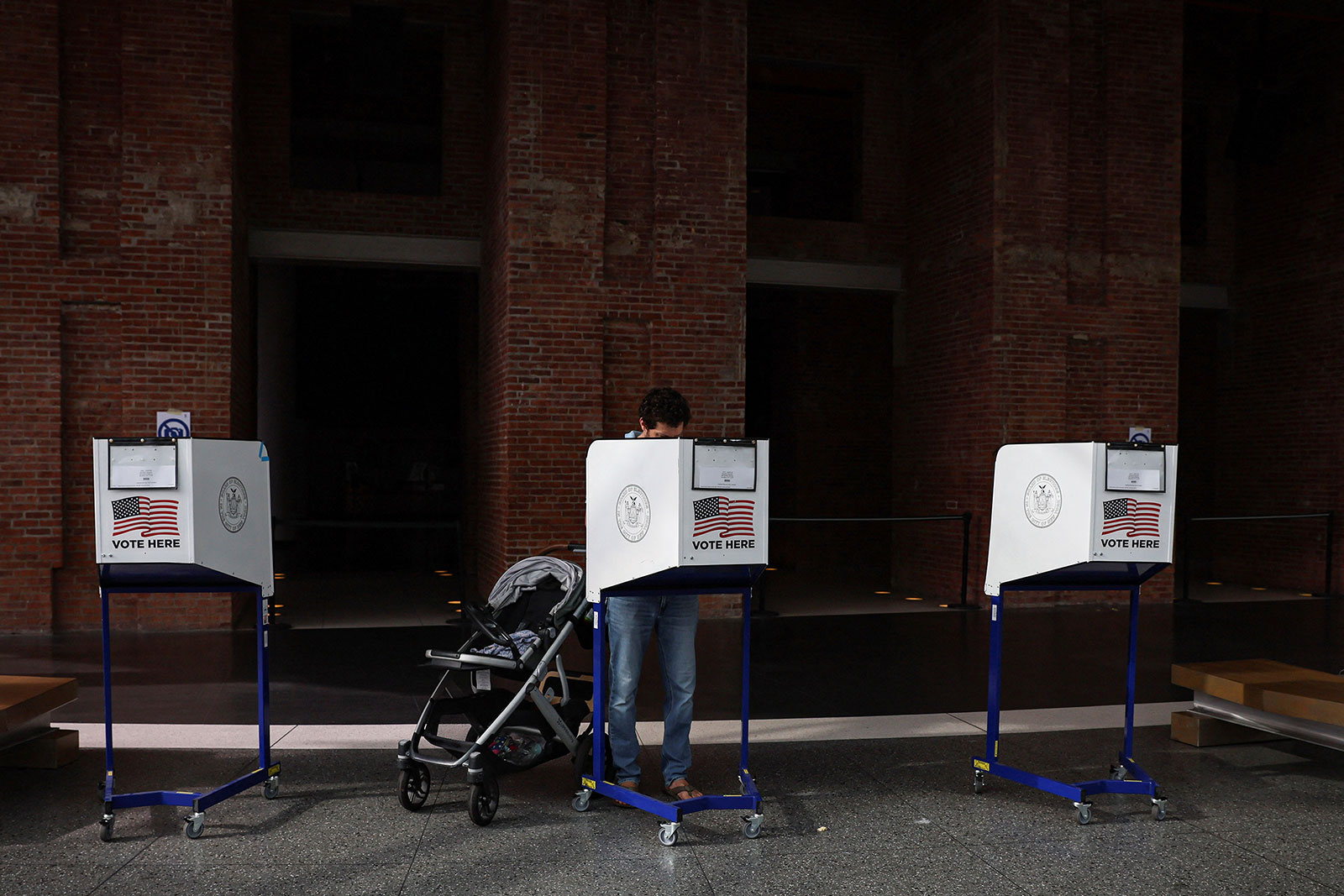 A voter fills out a ballot at a polling station in Brooklyn, New York, on Tuesday.